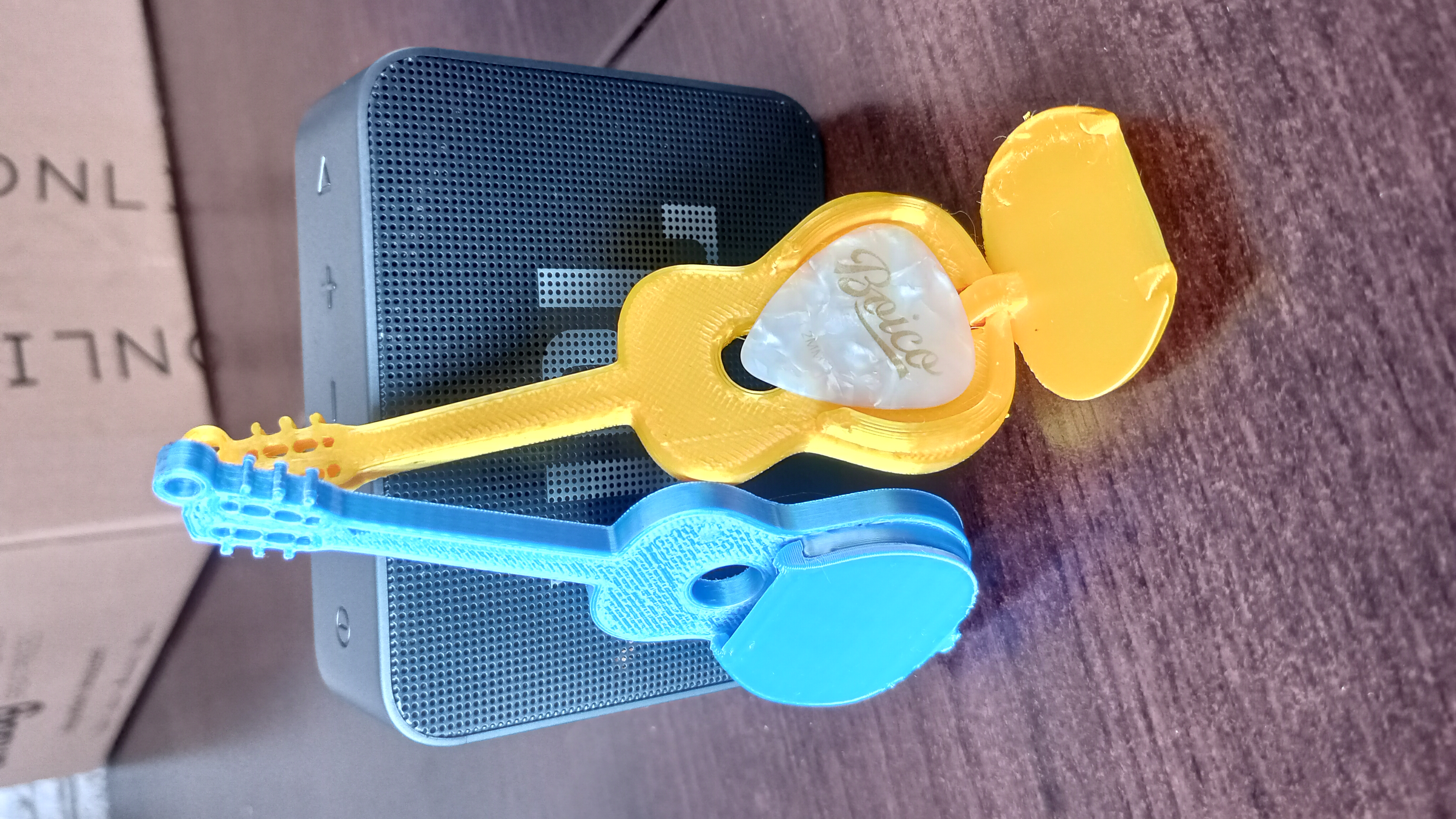 Keychain with storage for a guitar pick...