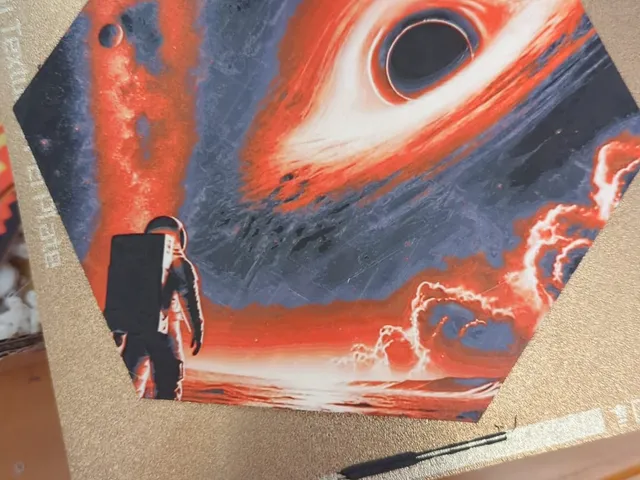 Hueforge hex - Astronaut looking at a black hole