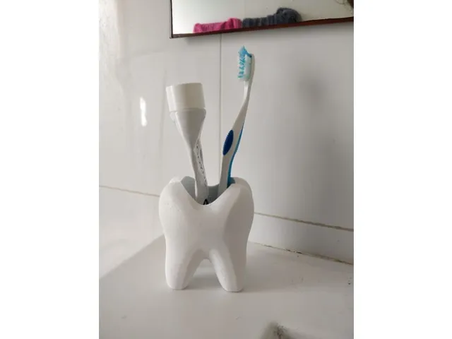A cup for toothbrush and toothpaste