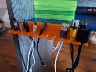 Clip on skadis cable holder