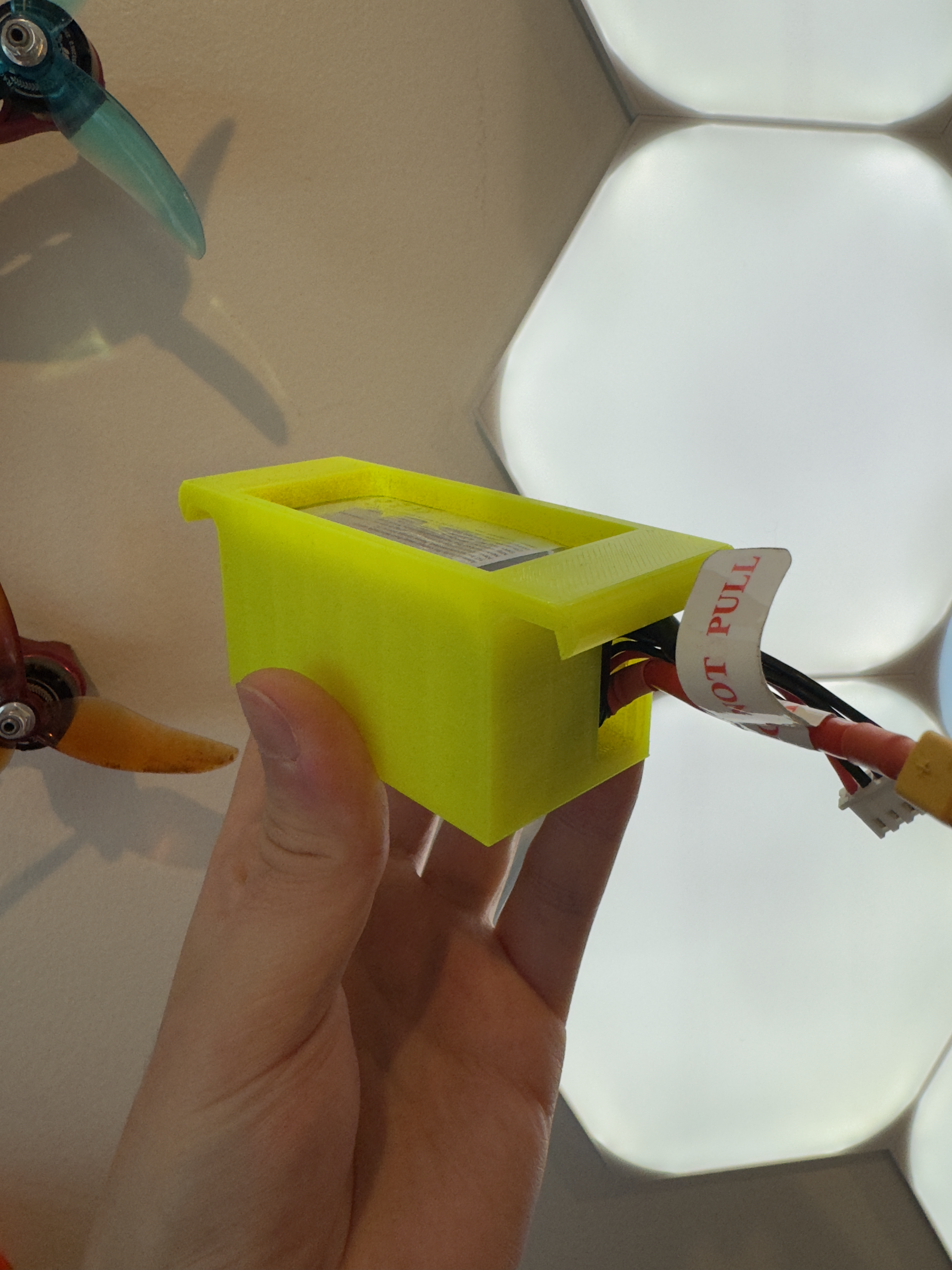 Battery holder for drone/quadcopter