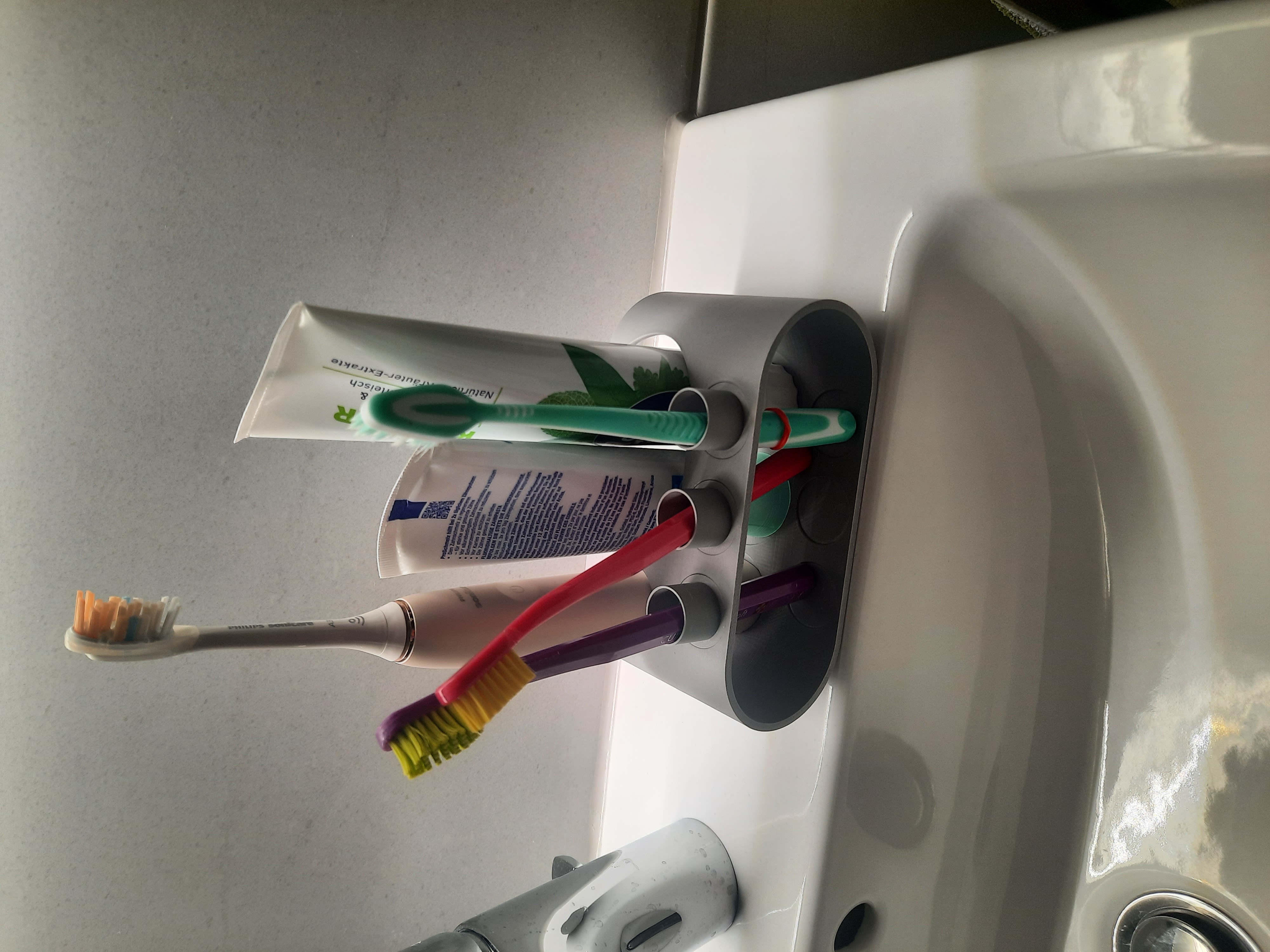 Toothbrush and toothpaste holder