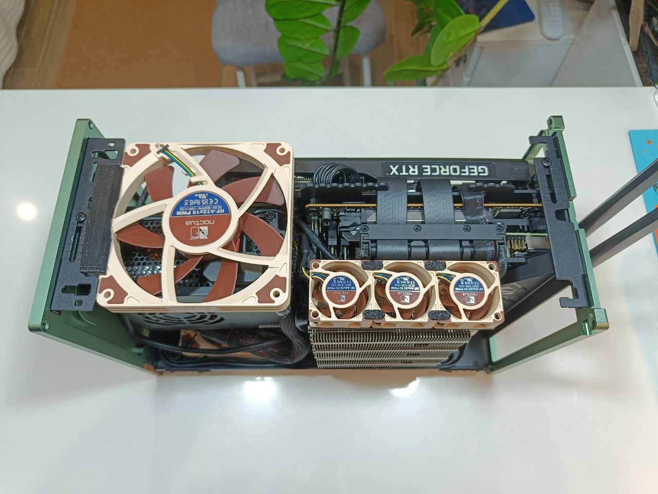 Brackets for mounting Noctua NF-A12x15 fan above PSU in Fractal Design Terra case.