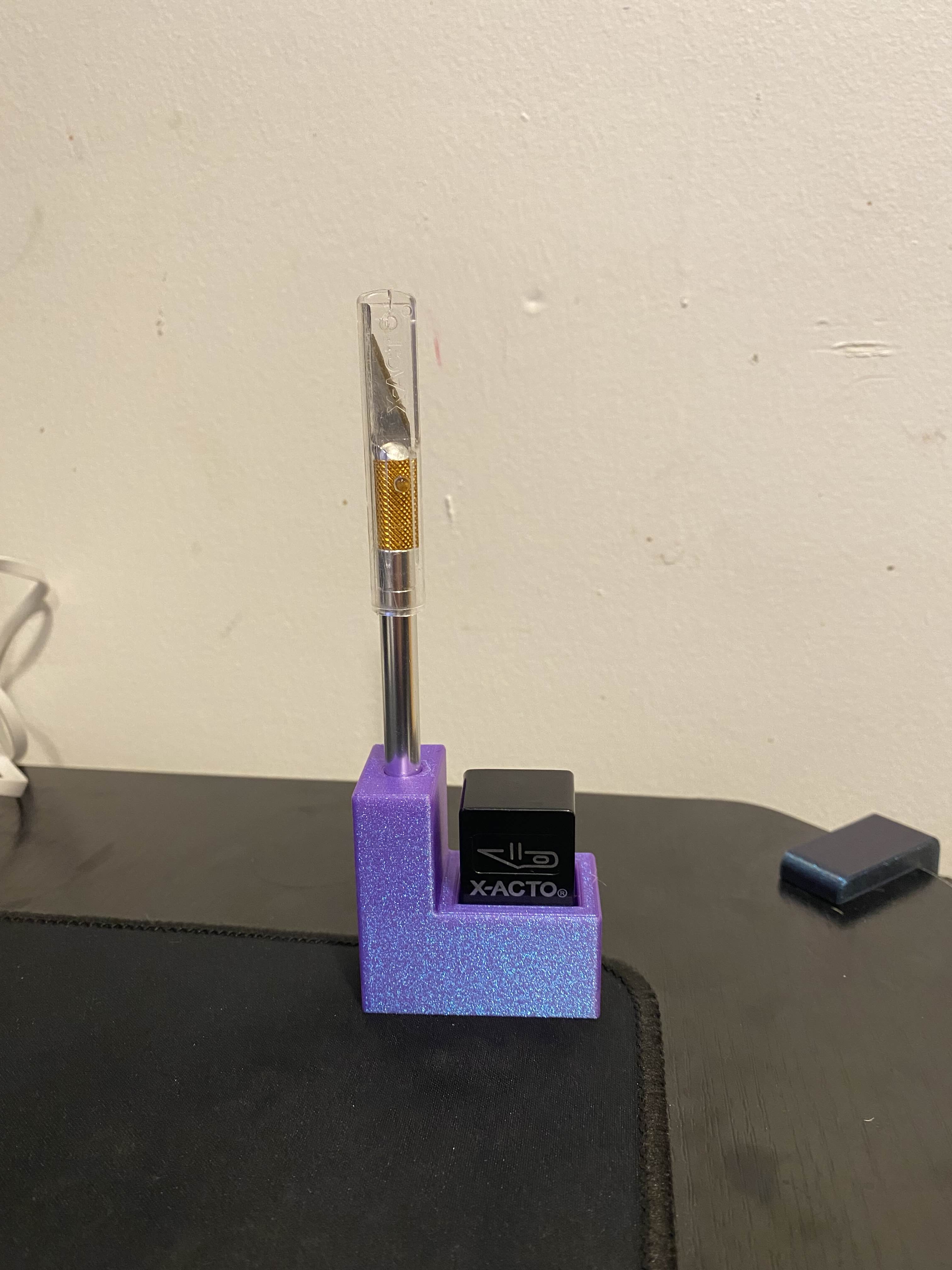 Xacto knife + blade holder mount for honeycomb wall