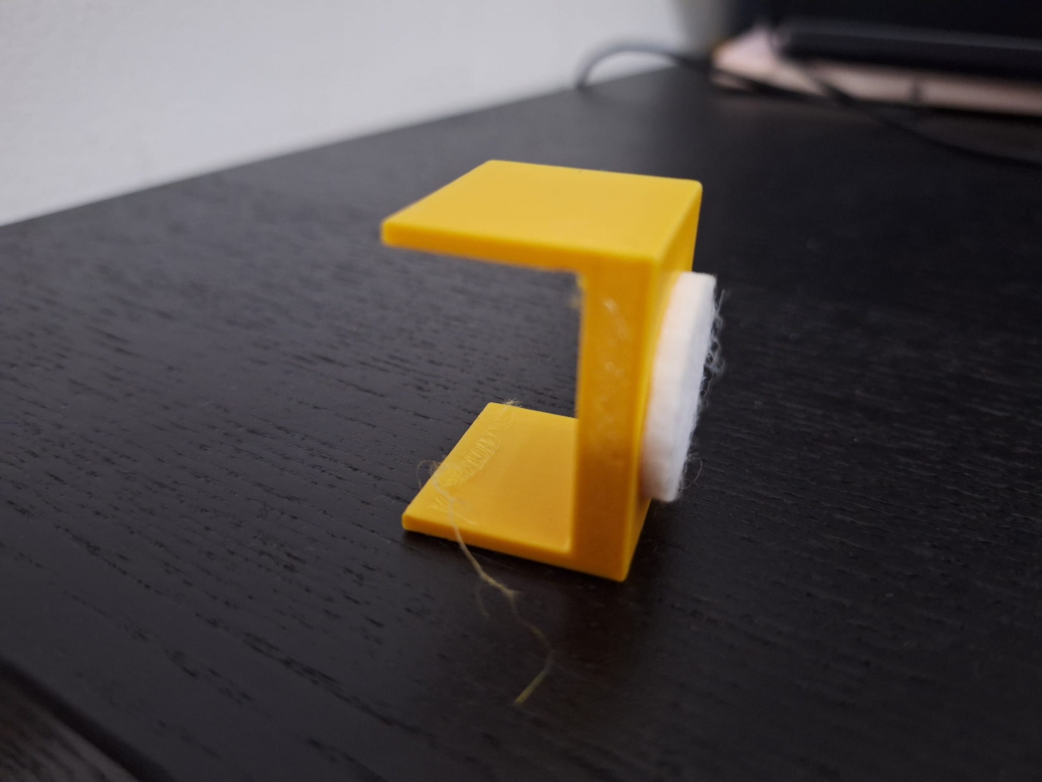 Desk wall spacer