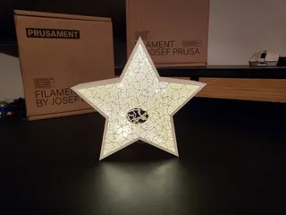 Christmas star with an ornament from little stars inside