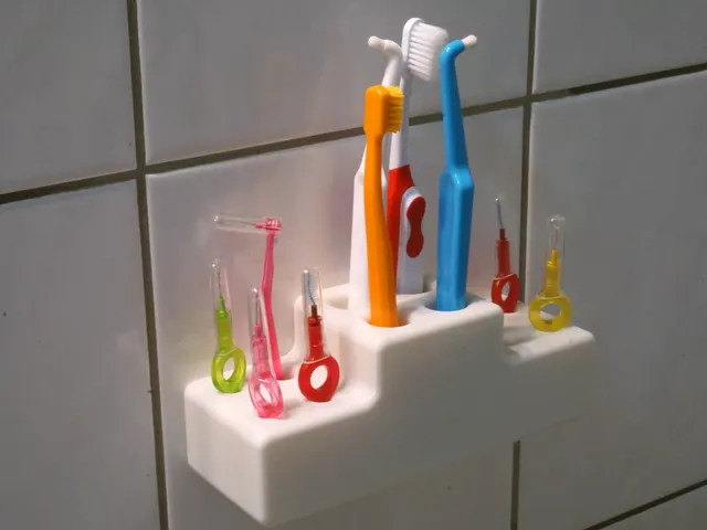 Tooth brush holder with holes for interdental brush