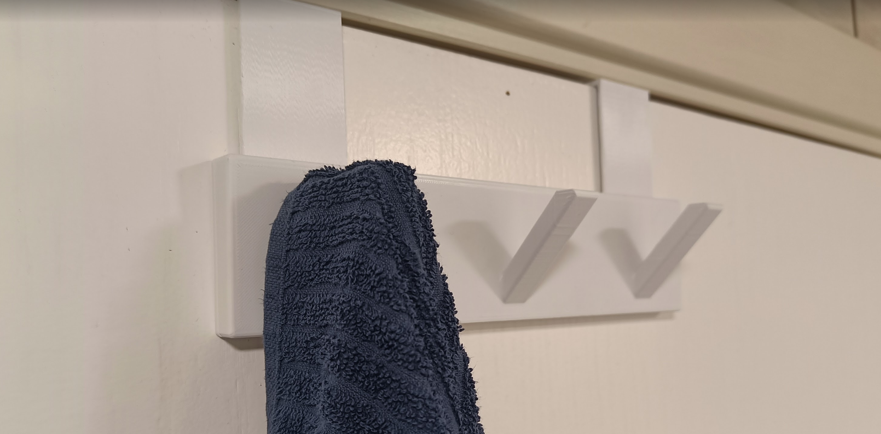 Simple door hanger for 3 towels.