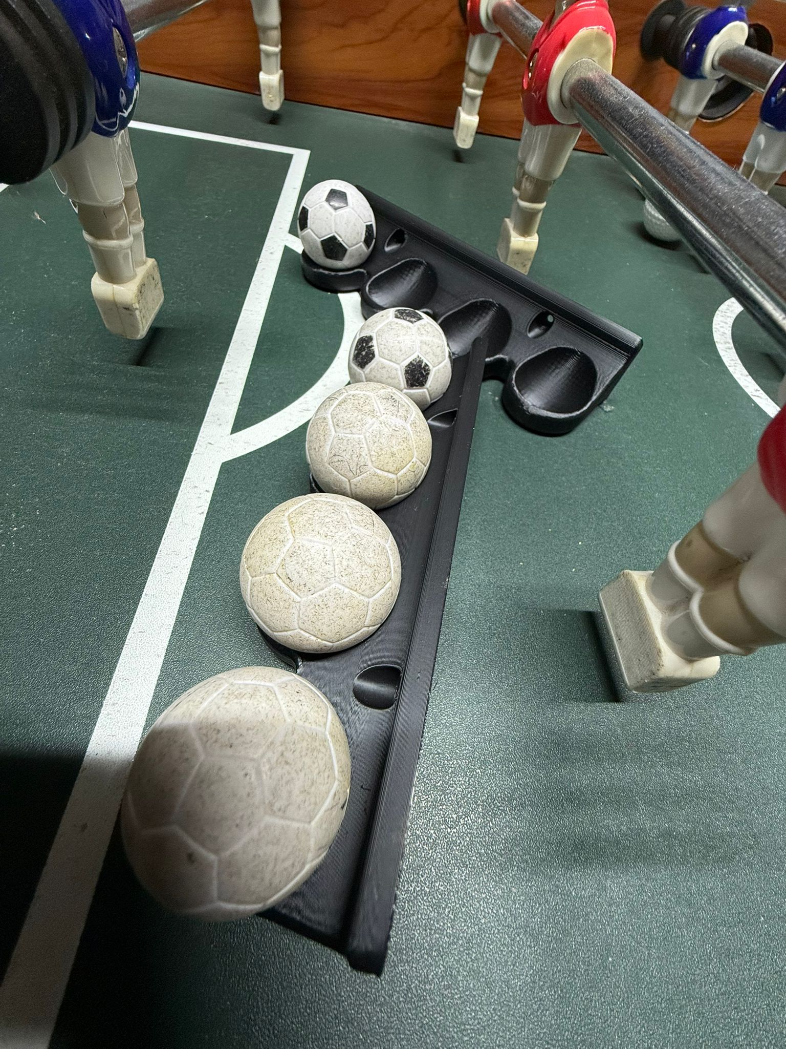Foosball ballholder with screw holes