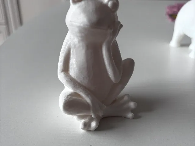 Sculpture of a thinking frog