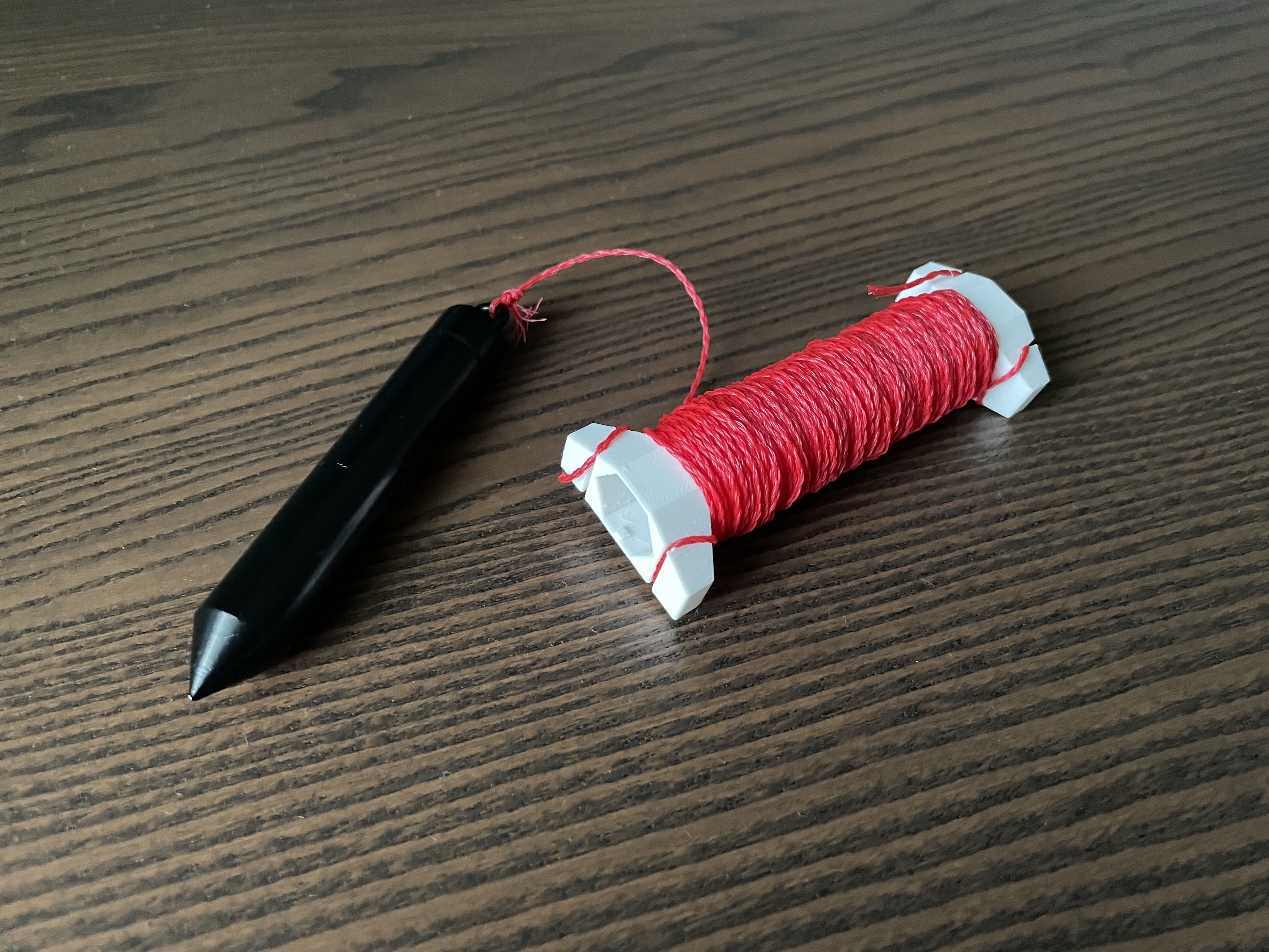 Plumb bob spool