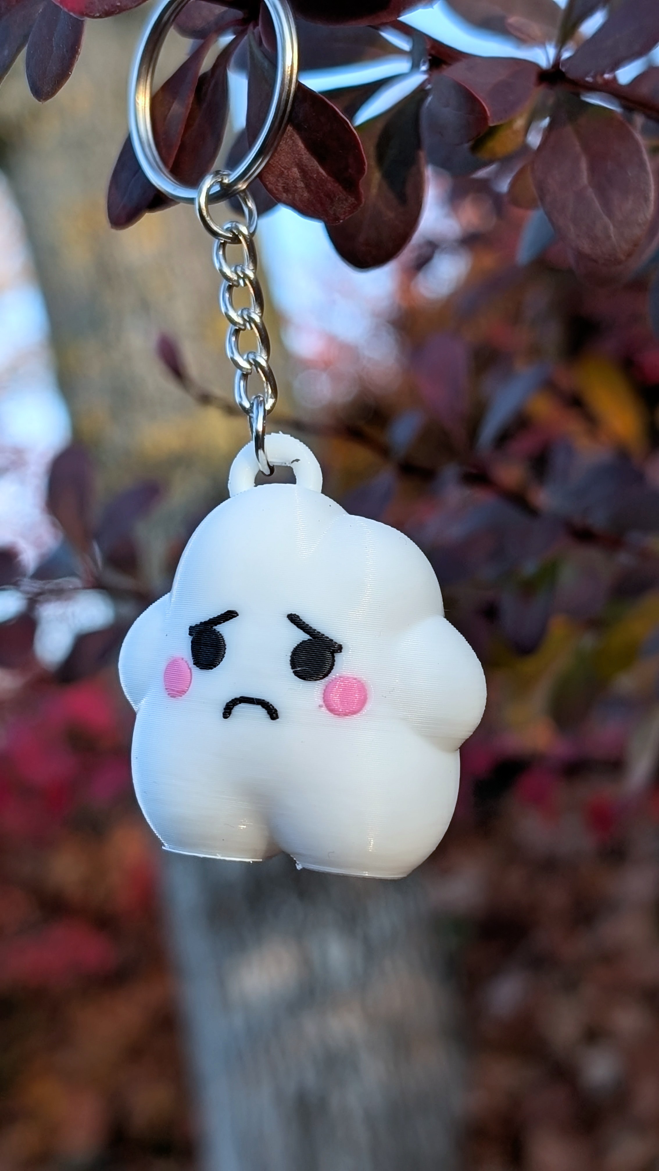 Claude, the sad cloud keychain version