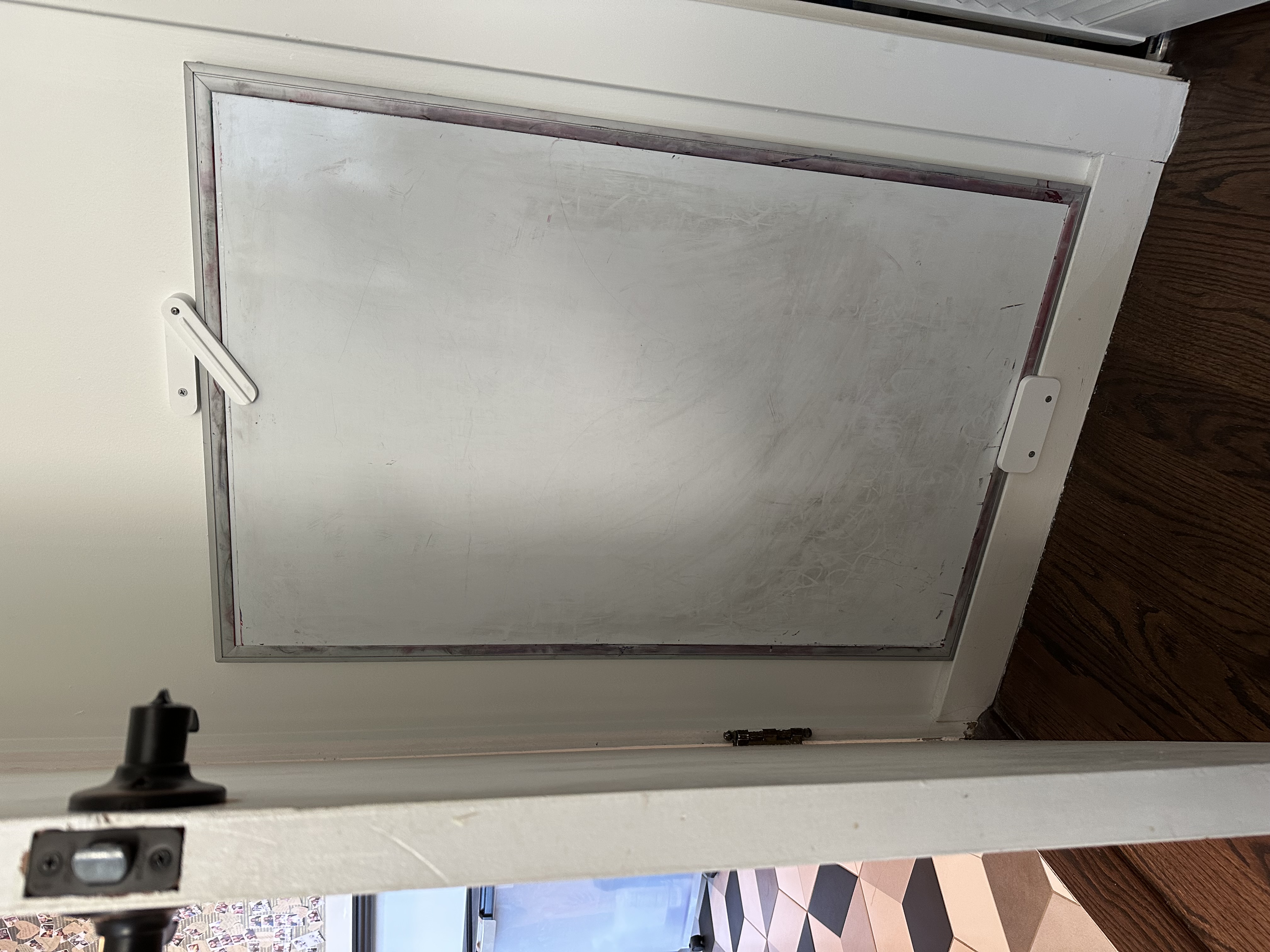 White board behind door storage holder