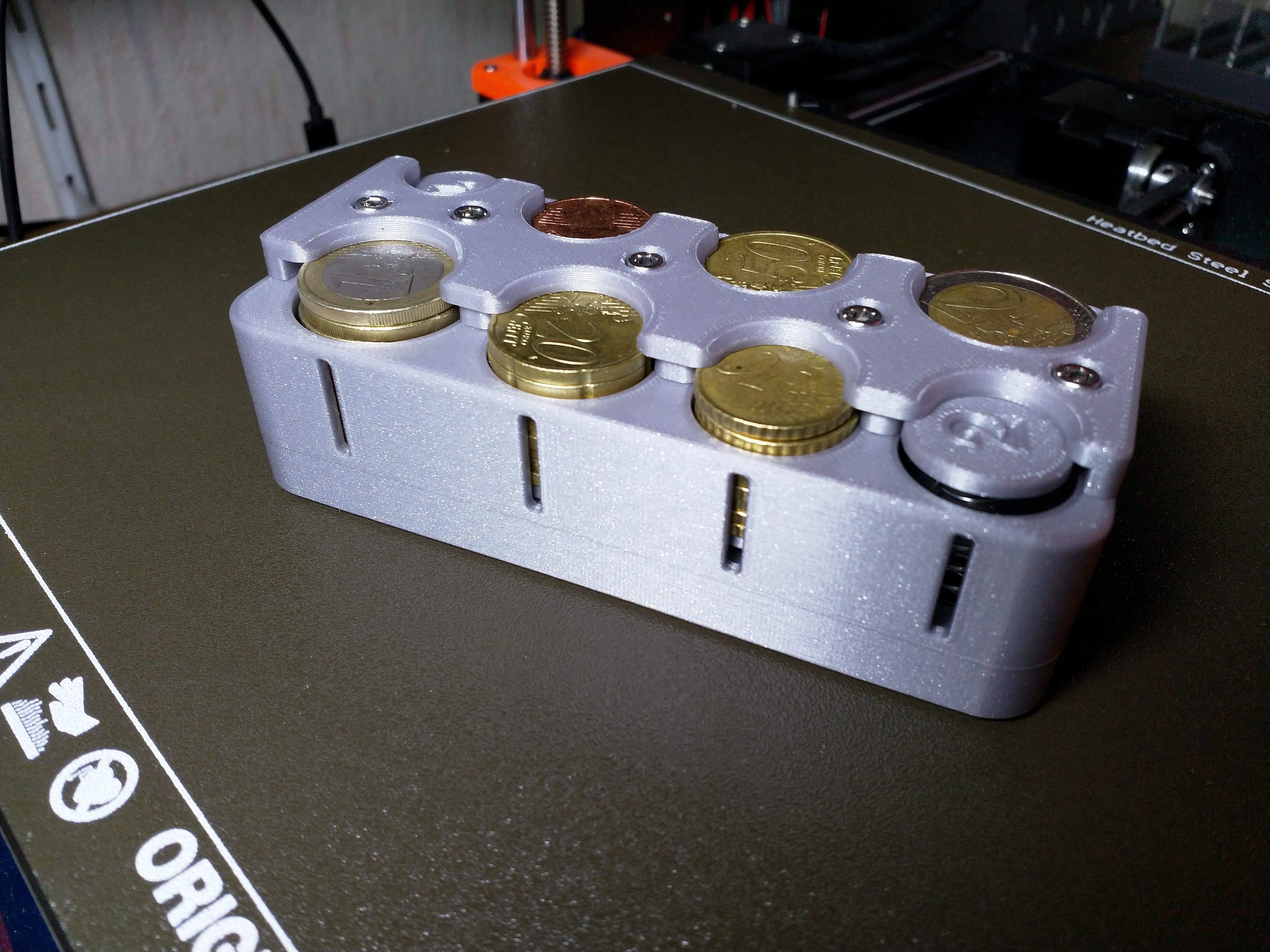 Euro coin dispenser with screws