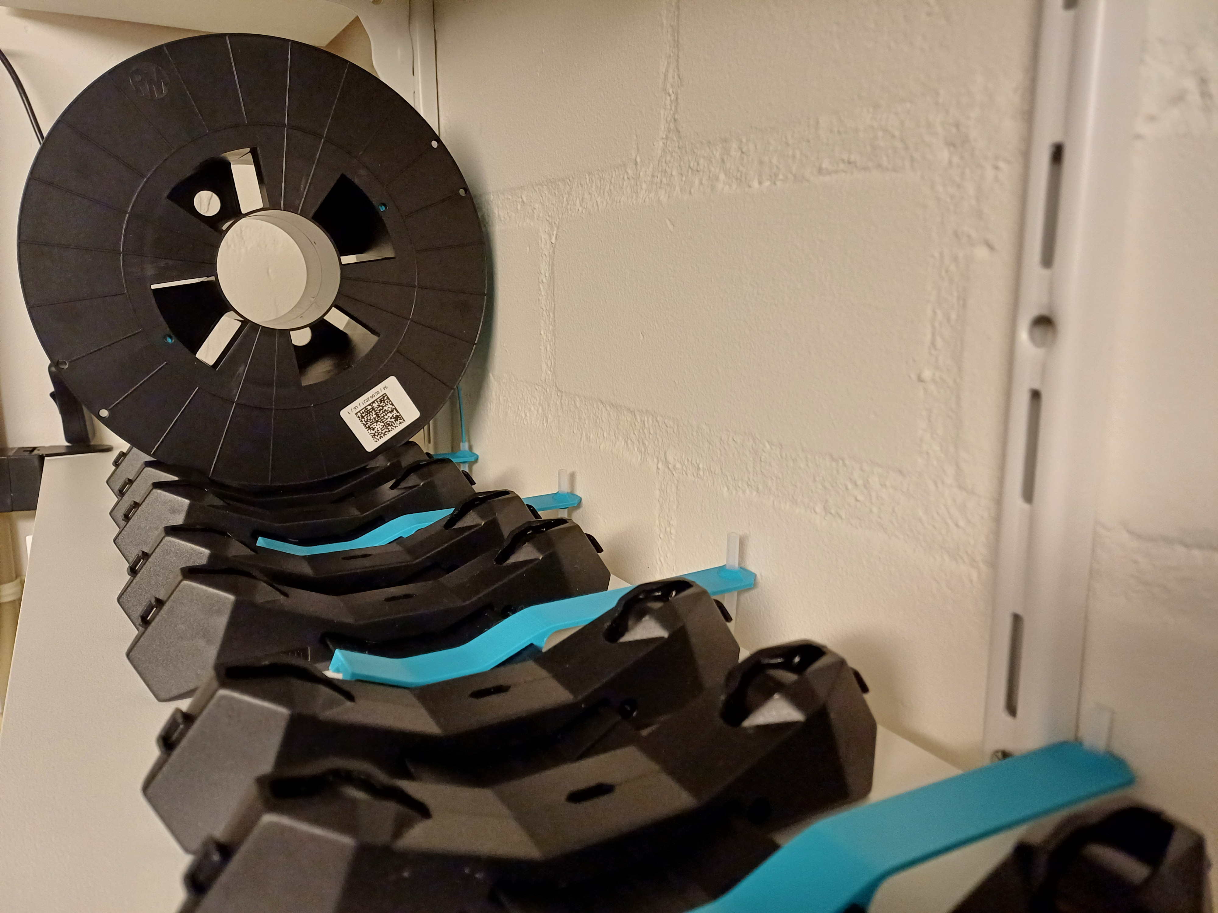 PTFE holder used for the injection molded Spool holder - R4 with the hole relocated and rotated.