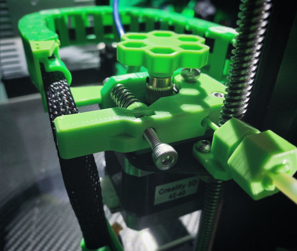 Adjustable, one-piece, extended, rounded, extruder lever
