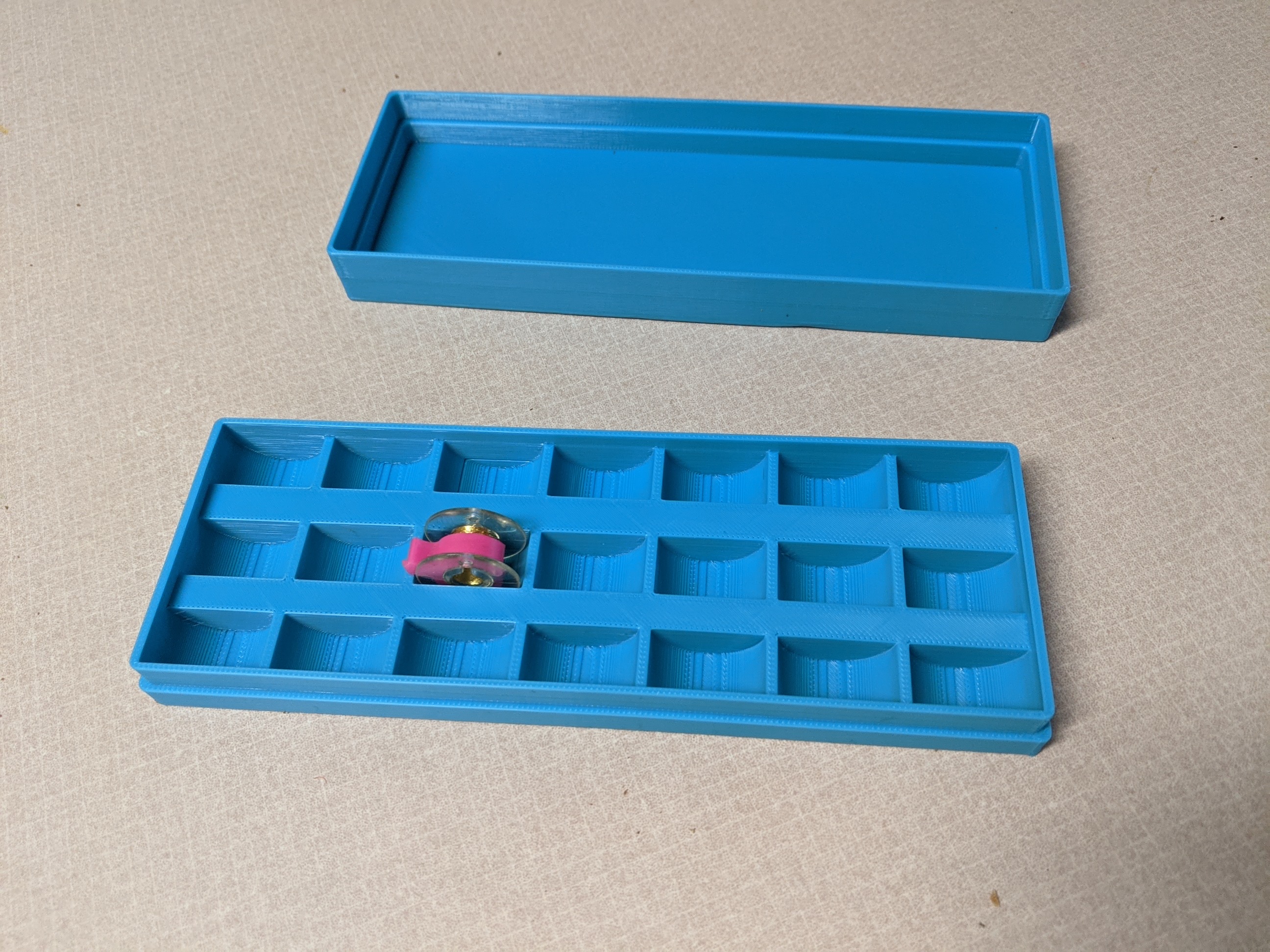 Sewing machine bobbin box