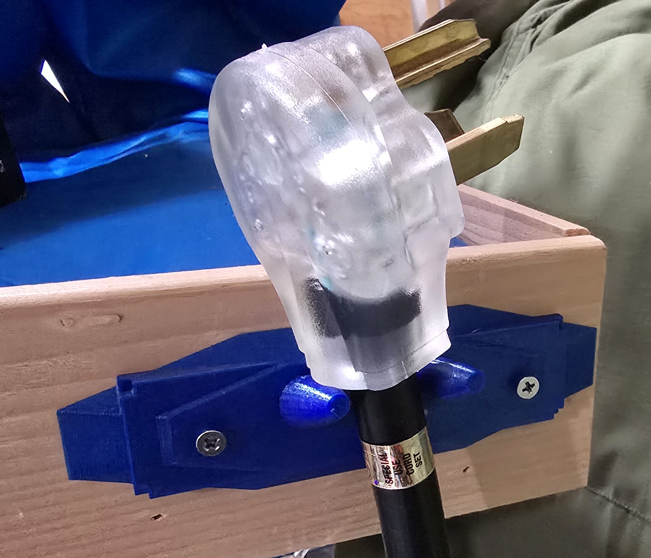 Wall bracket for 220v-240v style (thick) extension cord