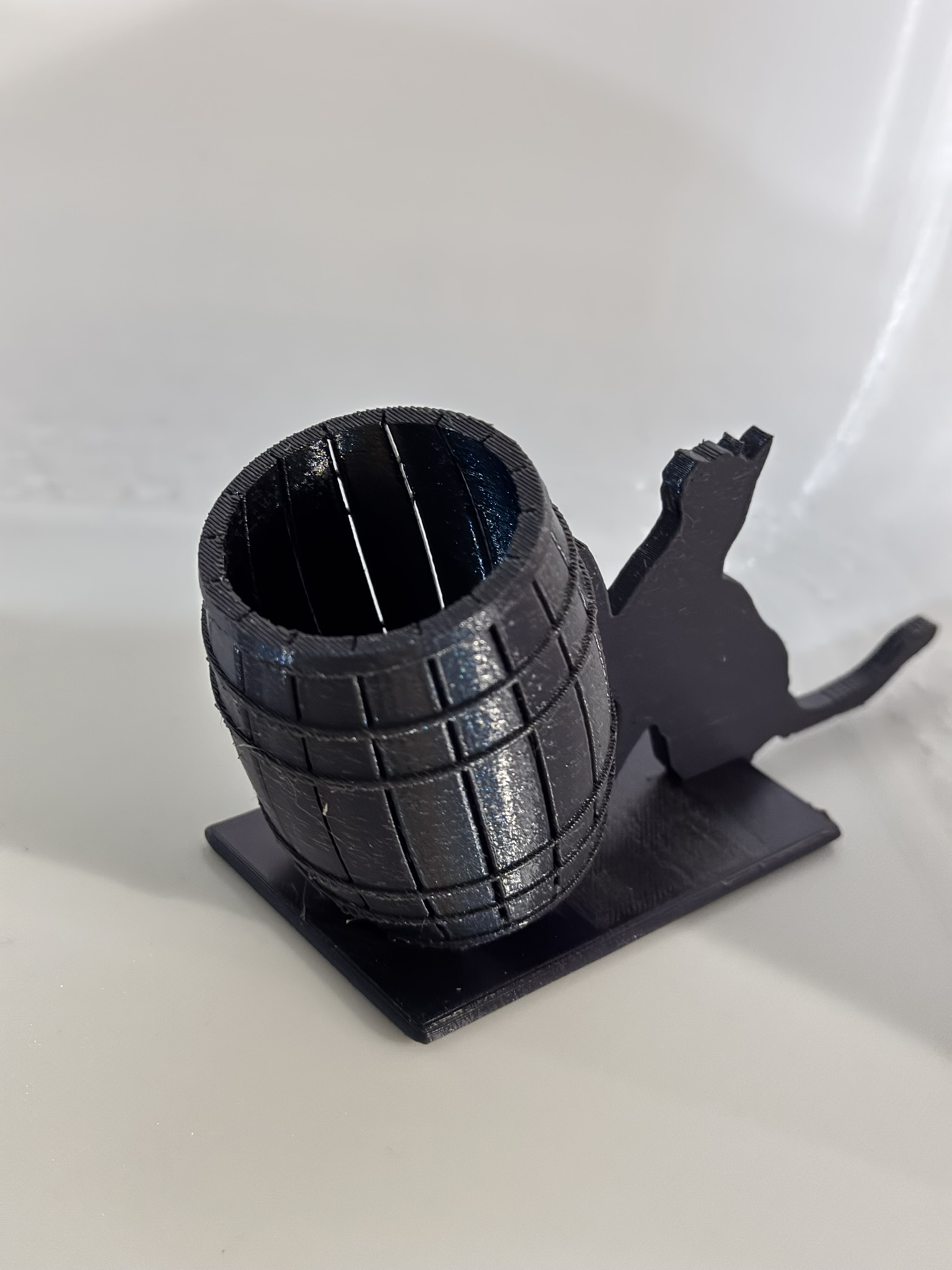 Cat pushing barrel q tip /pen holder
