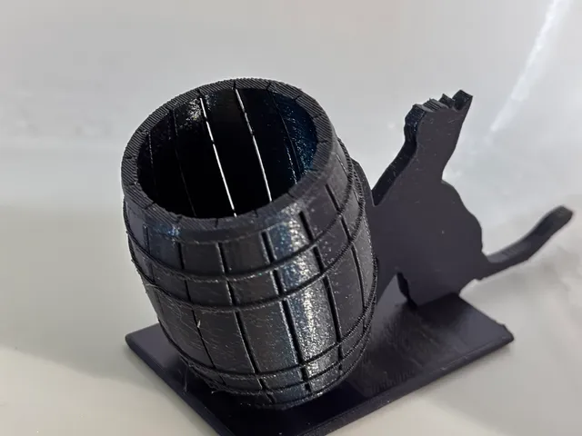 Cat pushing barrel q tip /pen holder