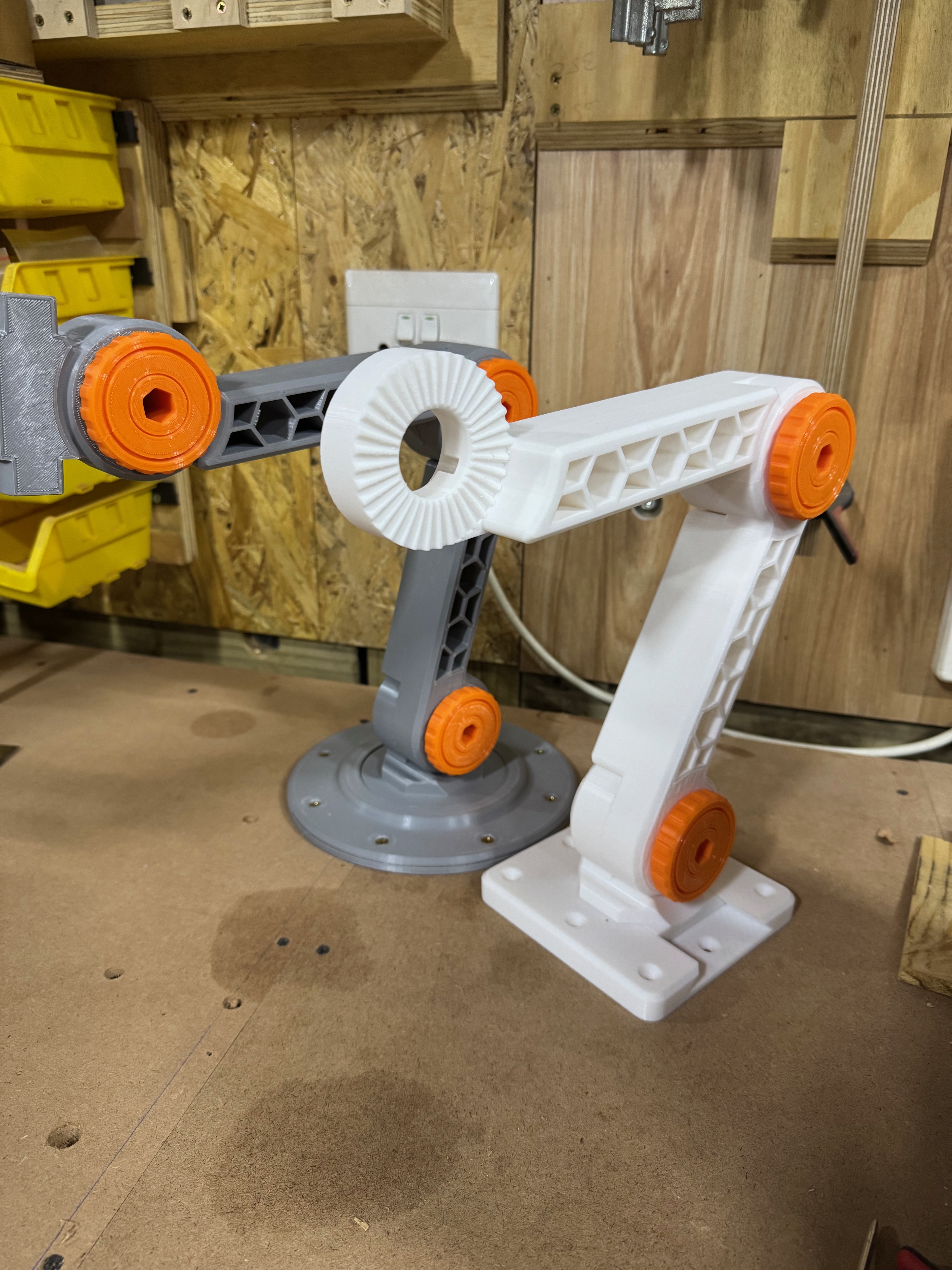 Base variations for multifunction arm mounting system