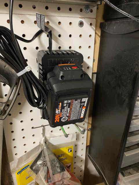 Worx lawn trimmer pegboard battery holder