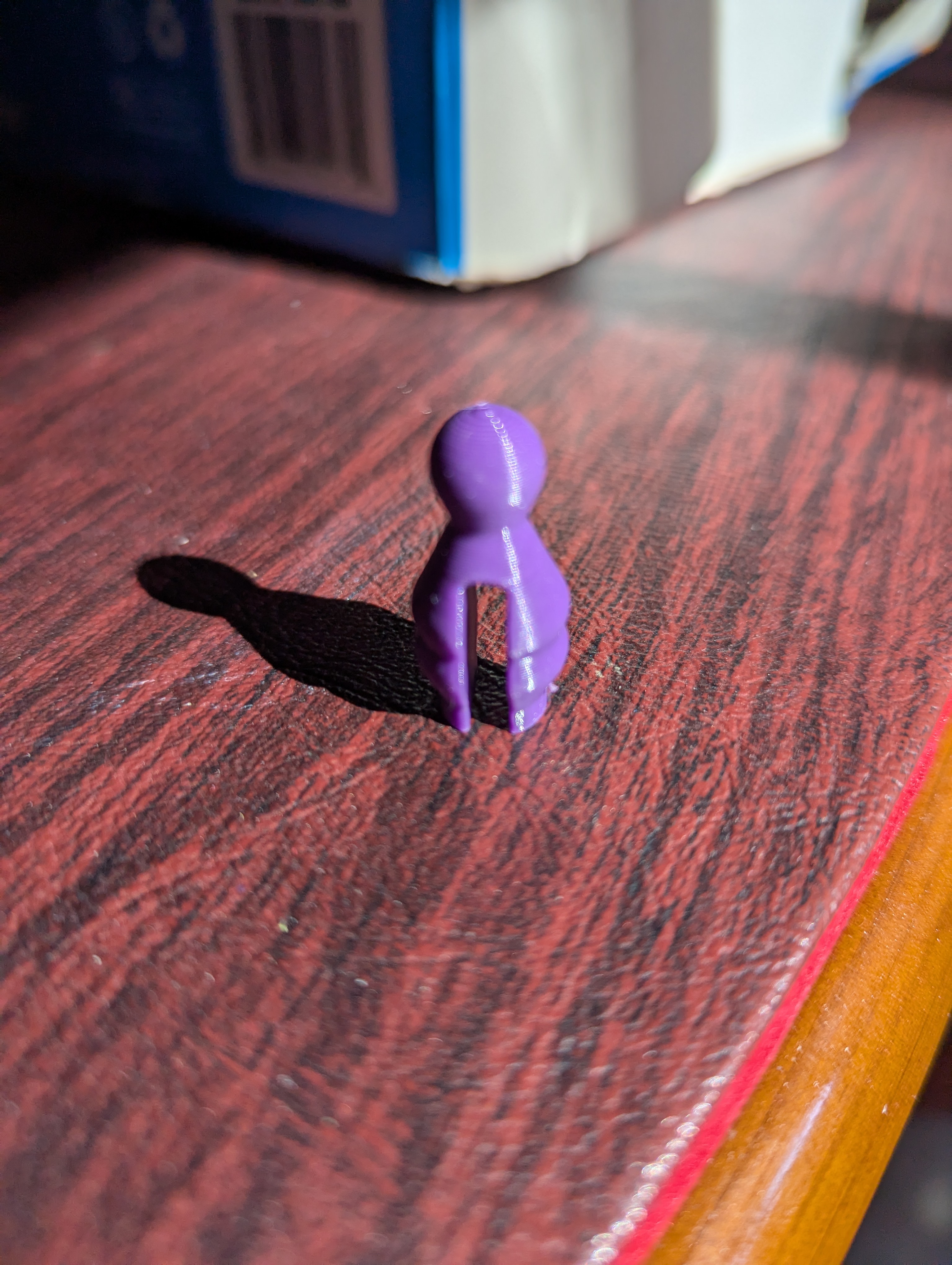 Squashed game piece