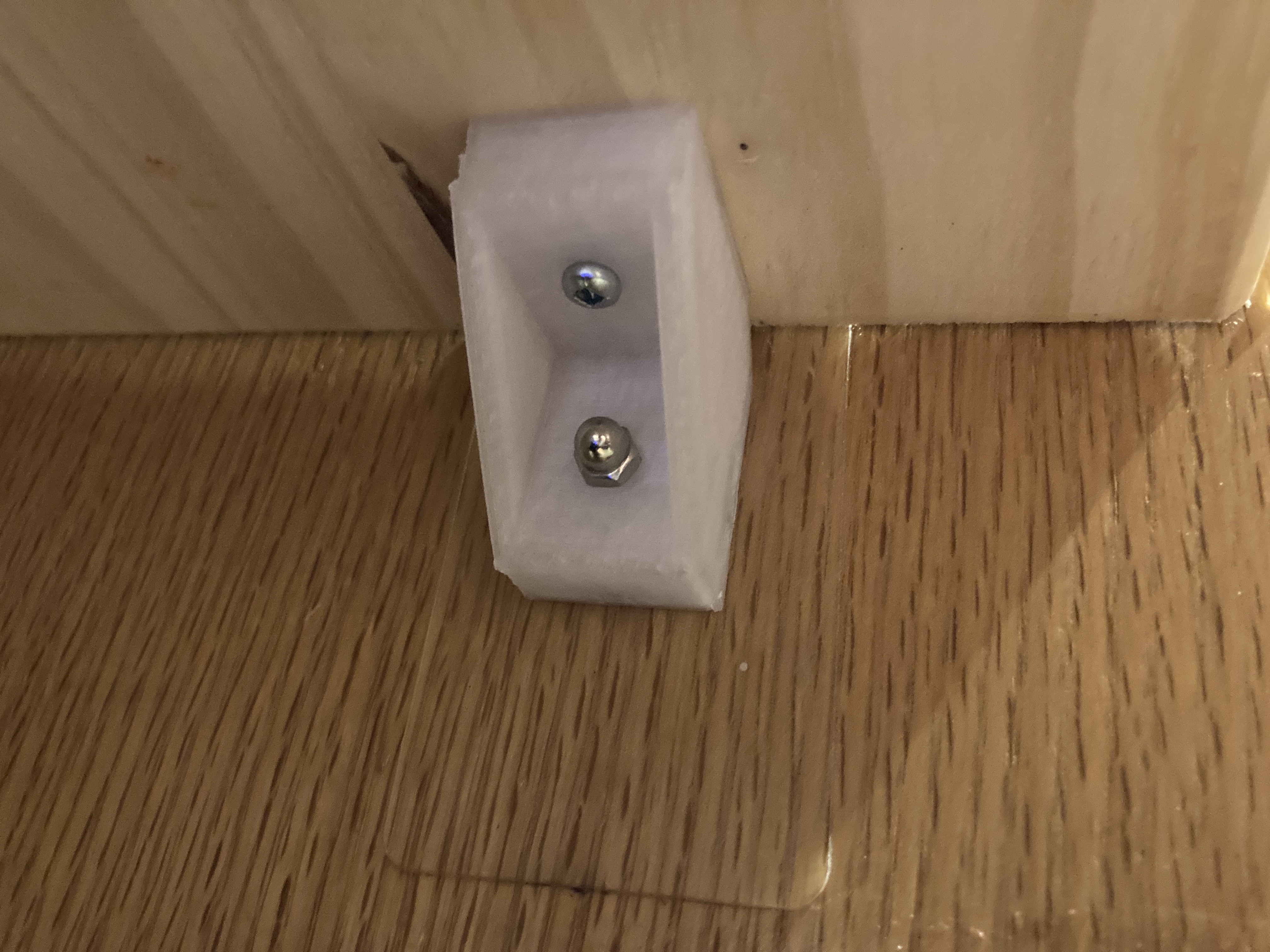 Shelf holder for adhesive studs.