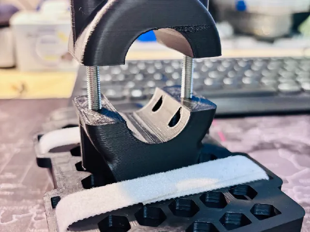 Holder for a power bank with a universal mount for a tripod, bike, or scooter.