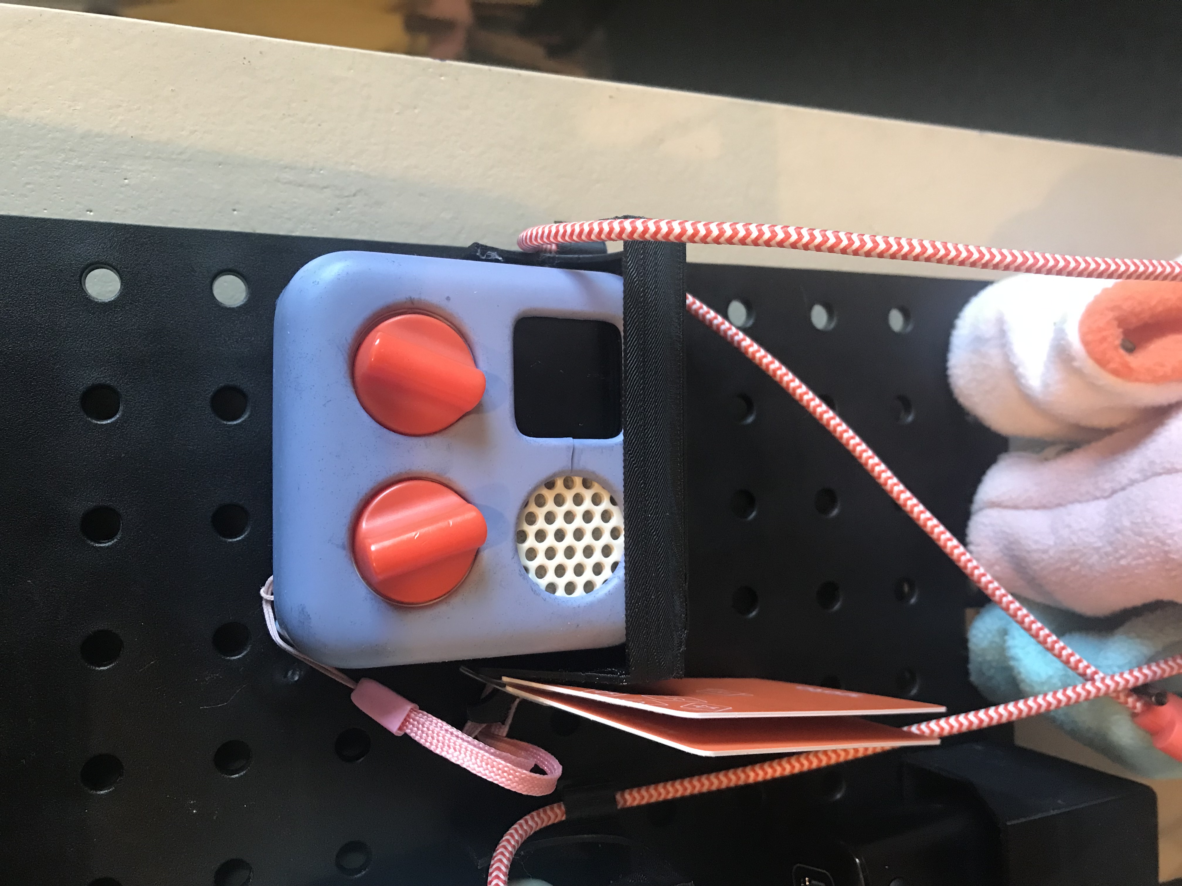 Yoto holder for pegboard