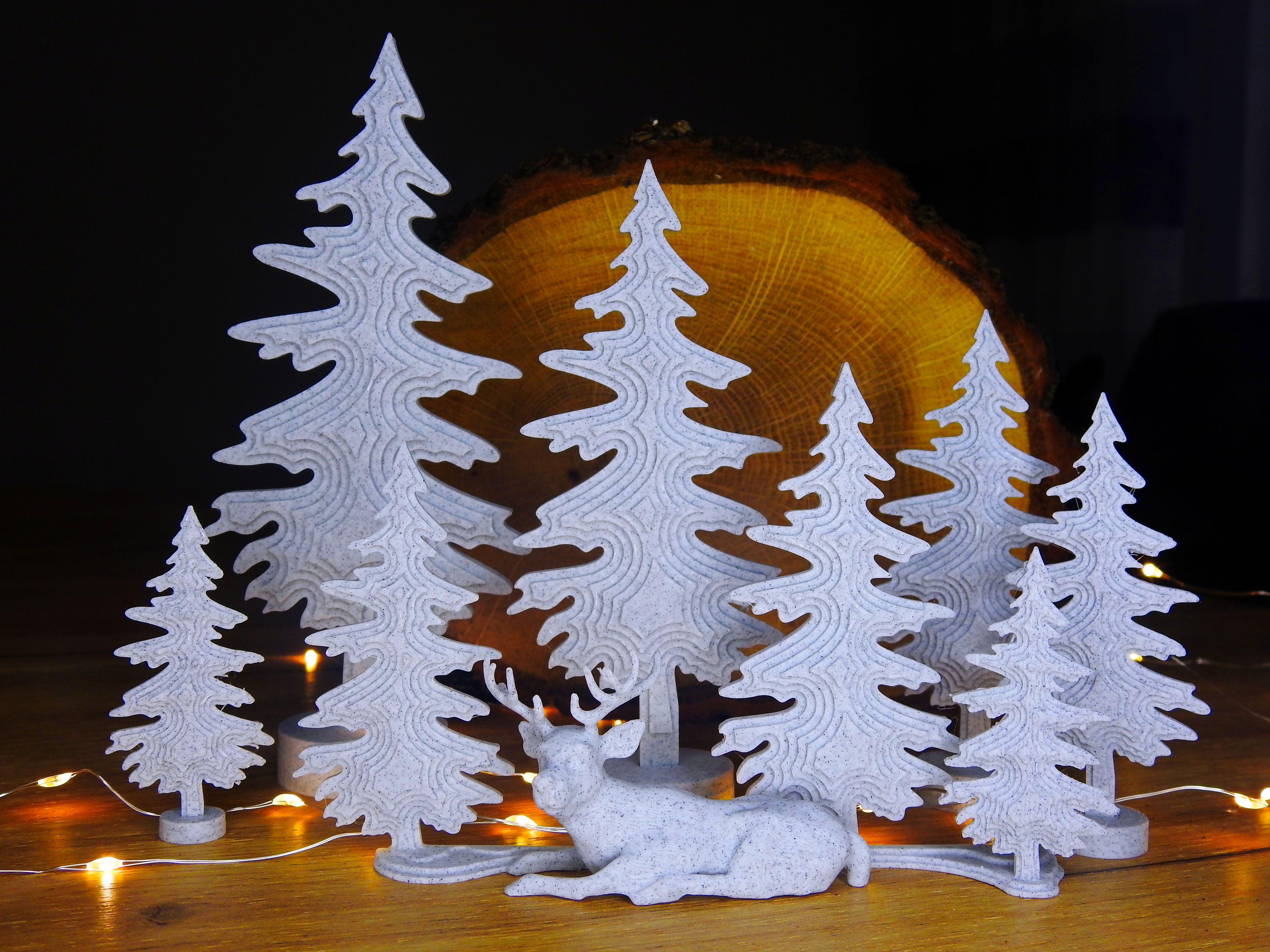 Sleepy deer with trees