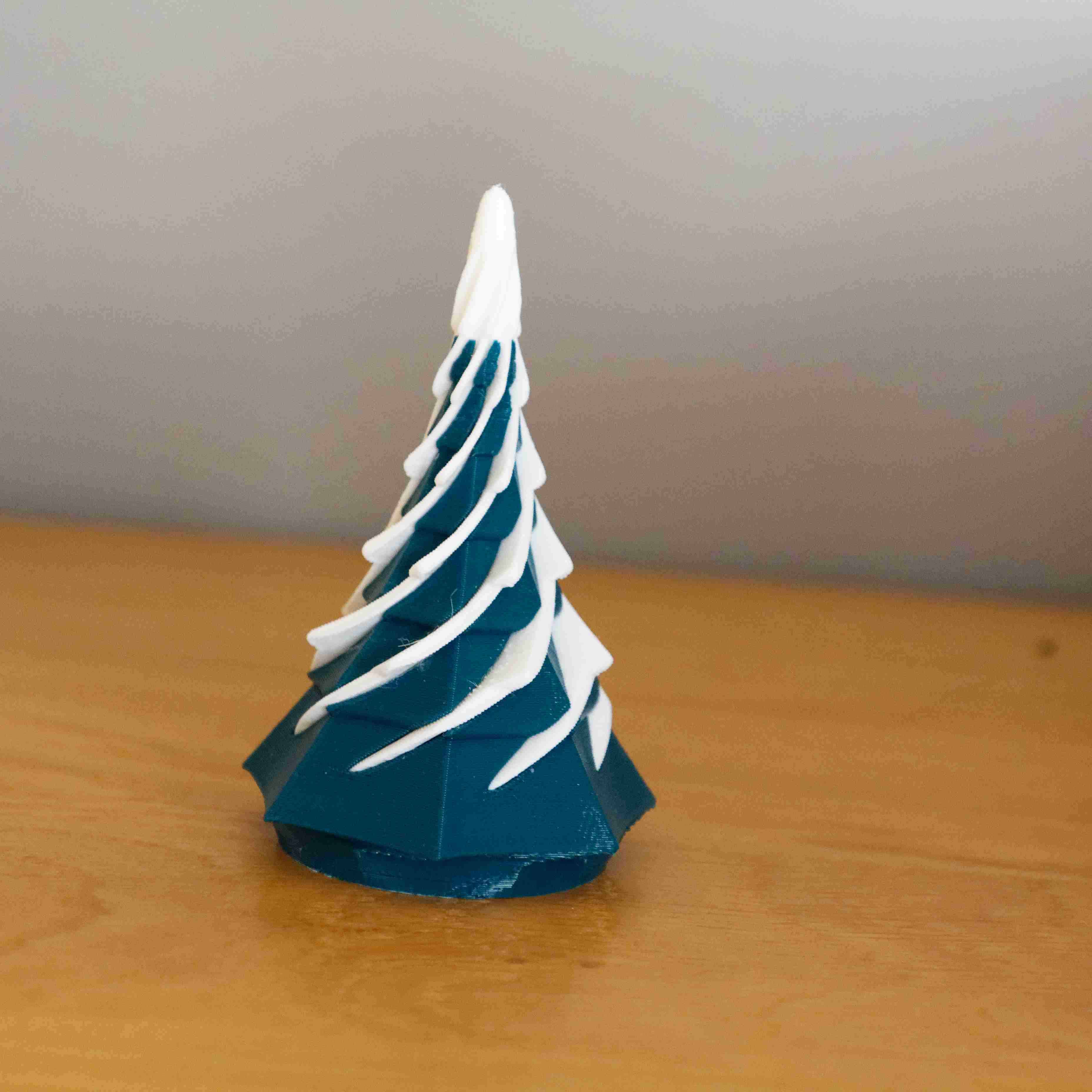 Twisted heptagon christmas tree with pass through snow