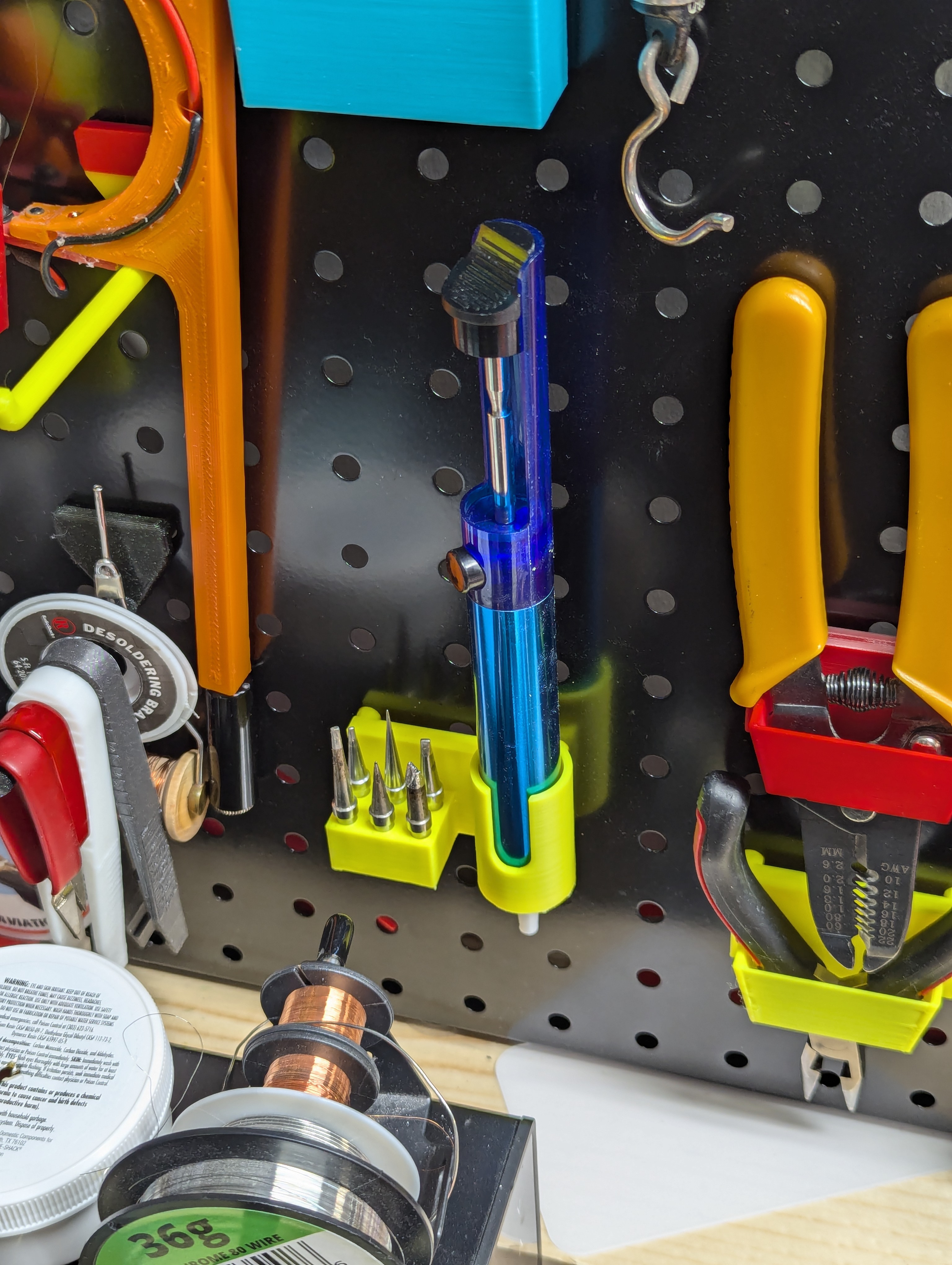 Solder sucker and tips pegboard mount