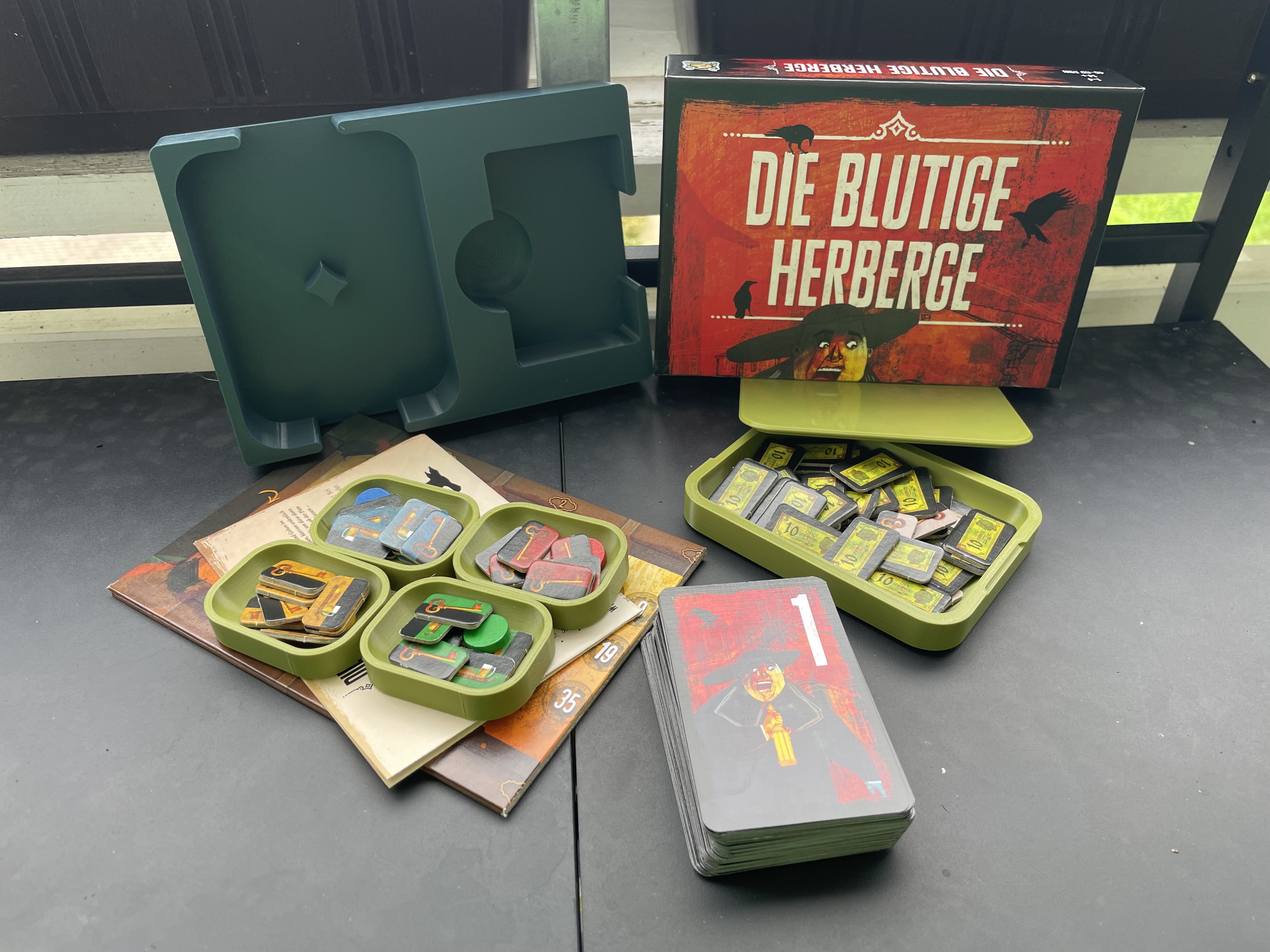 the bloody inn insert with a cut in half box