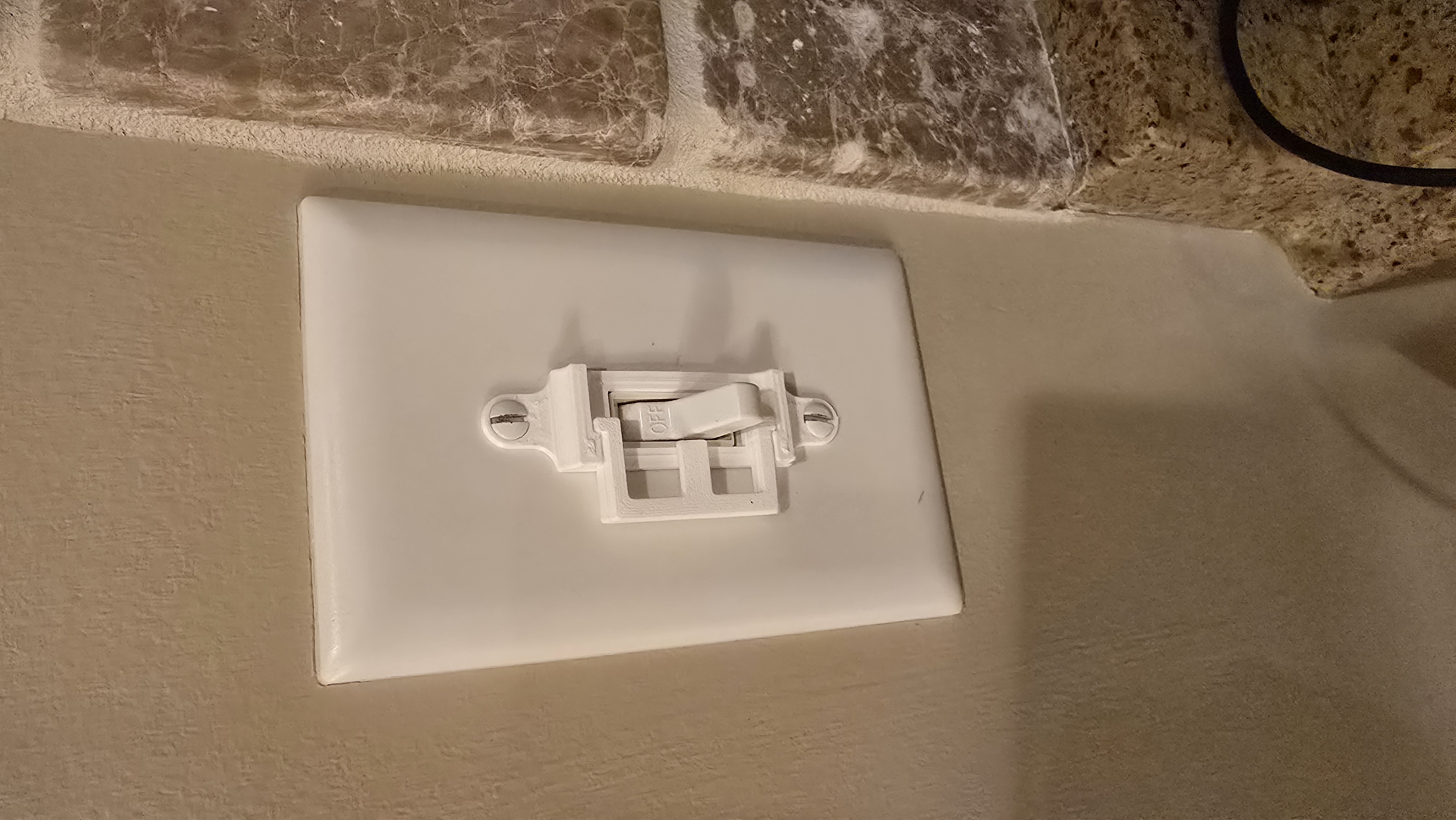 Light switch toggle lock