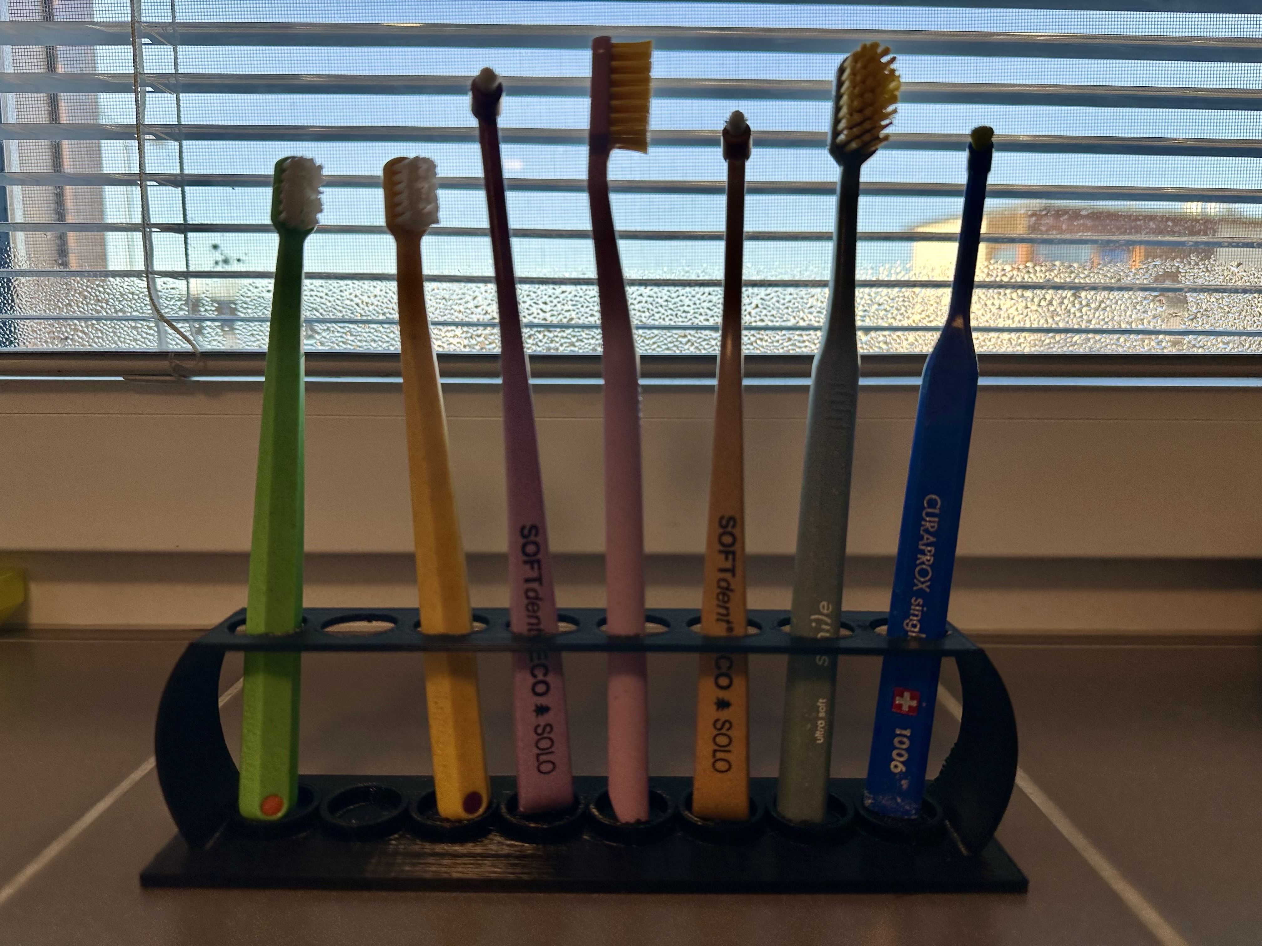 Toothbrush holder for a family of four