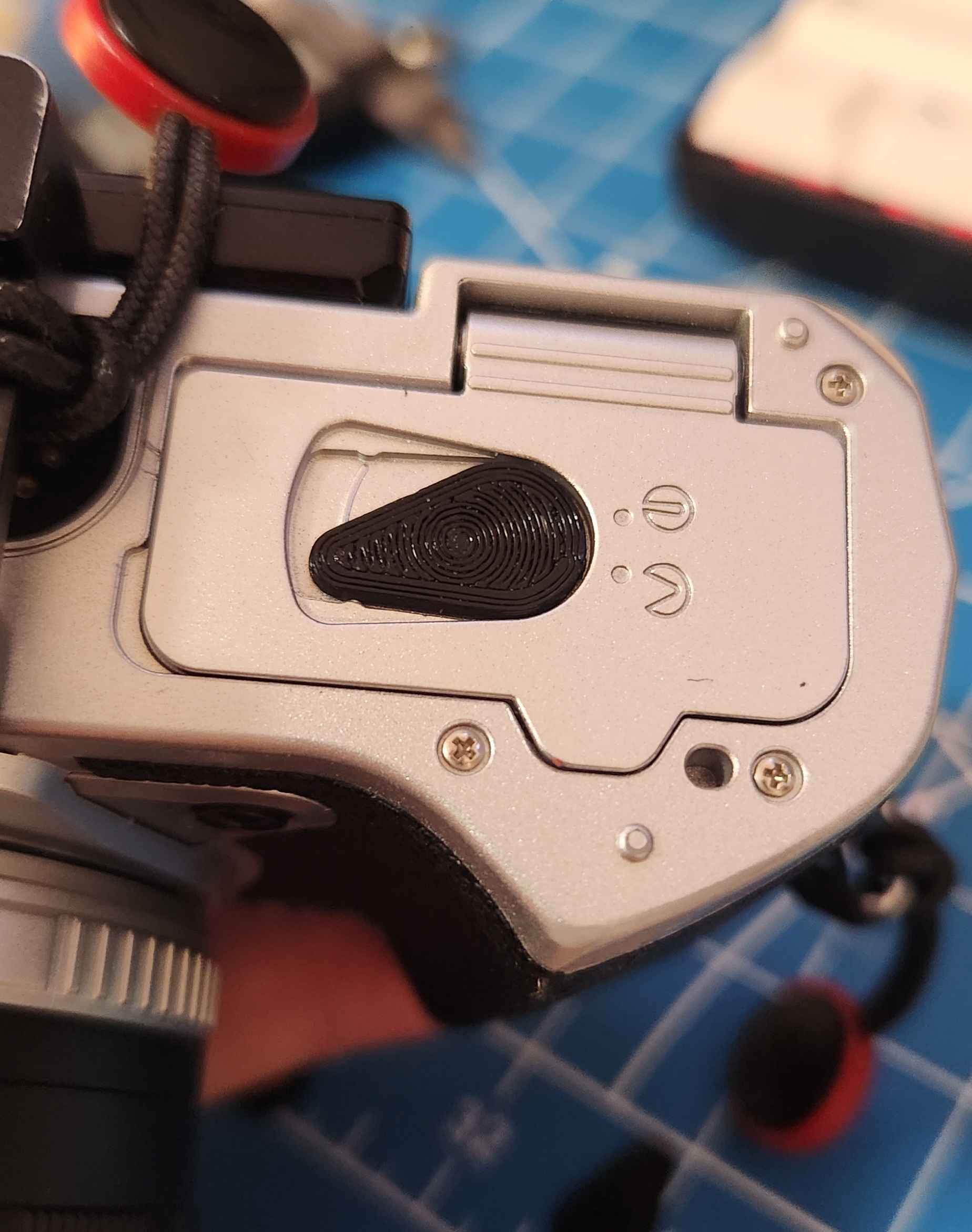 Battery door lever for Olympus E-M5 III