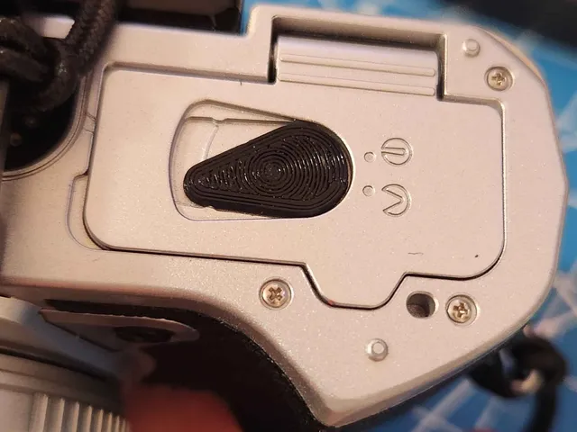 Battery door lever for Olympus E-M5 III