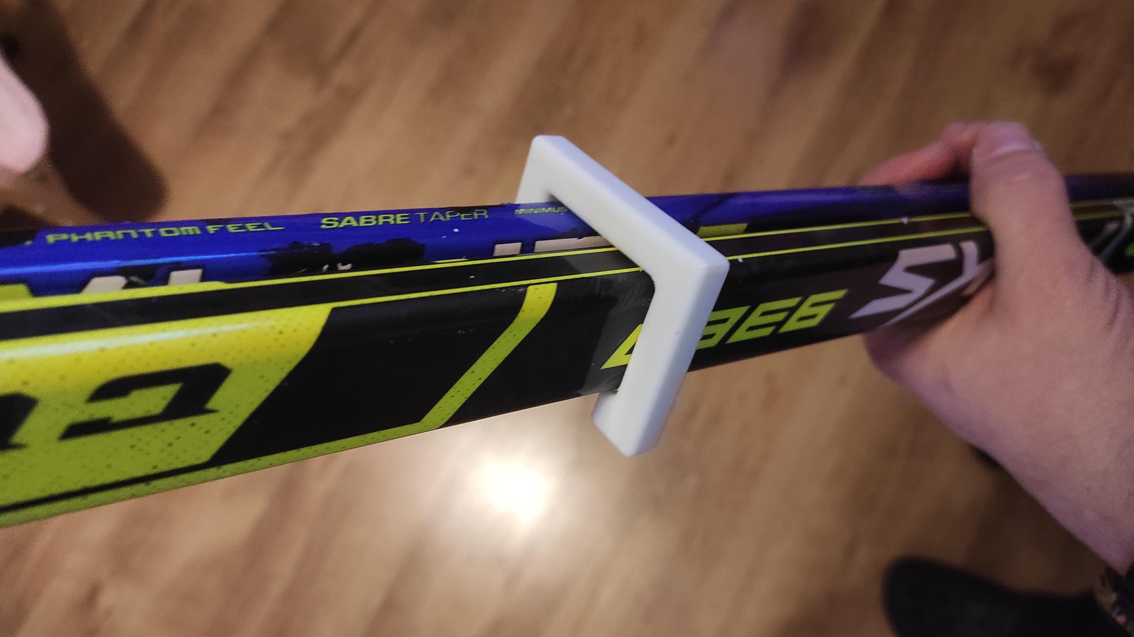 Holder for two hockey sticks