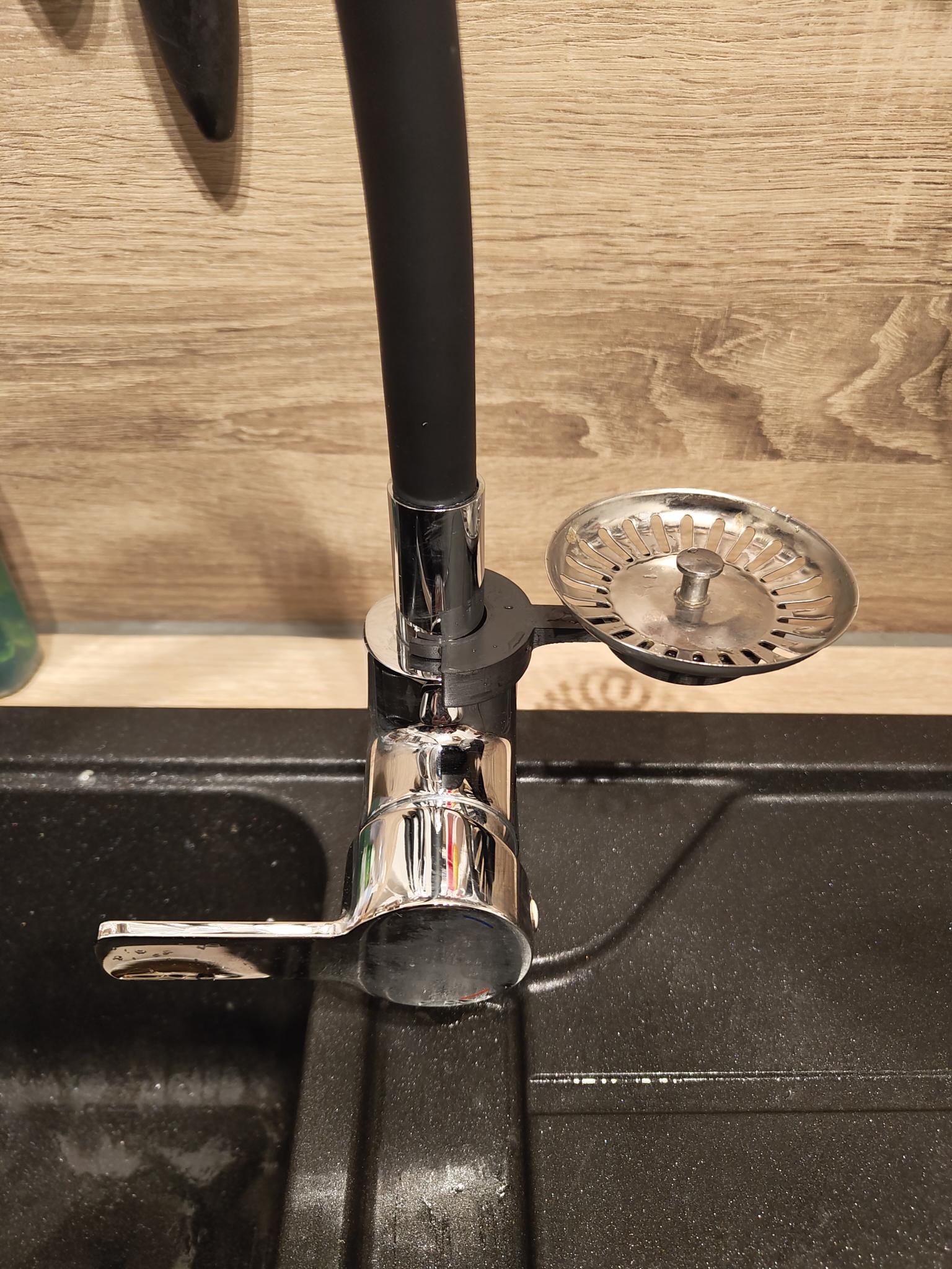 Sink plug holder for kitchen faucet