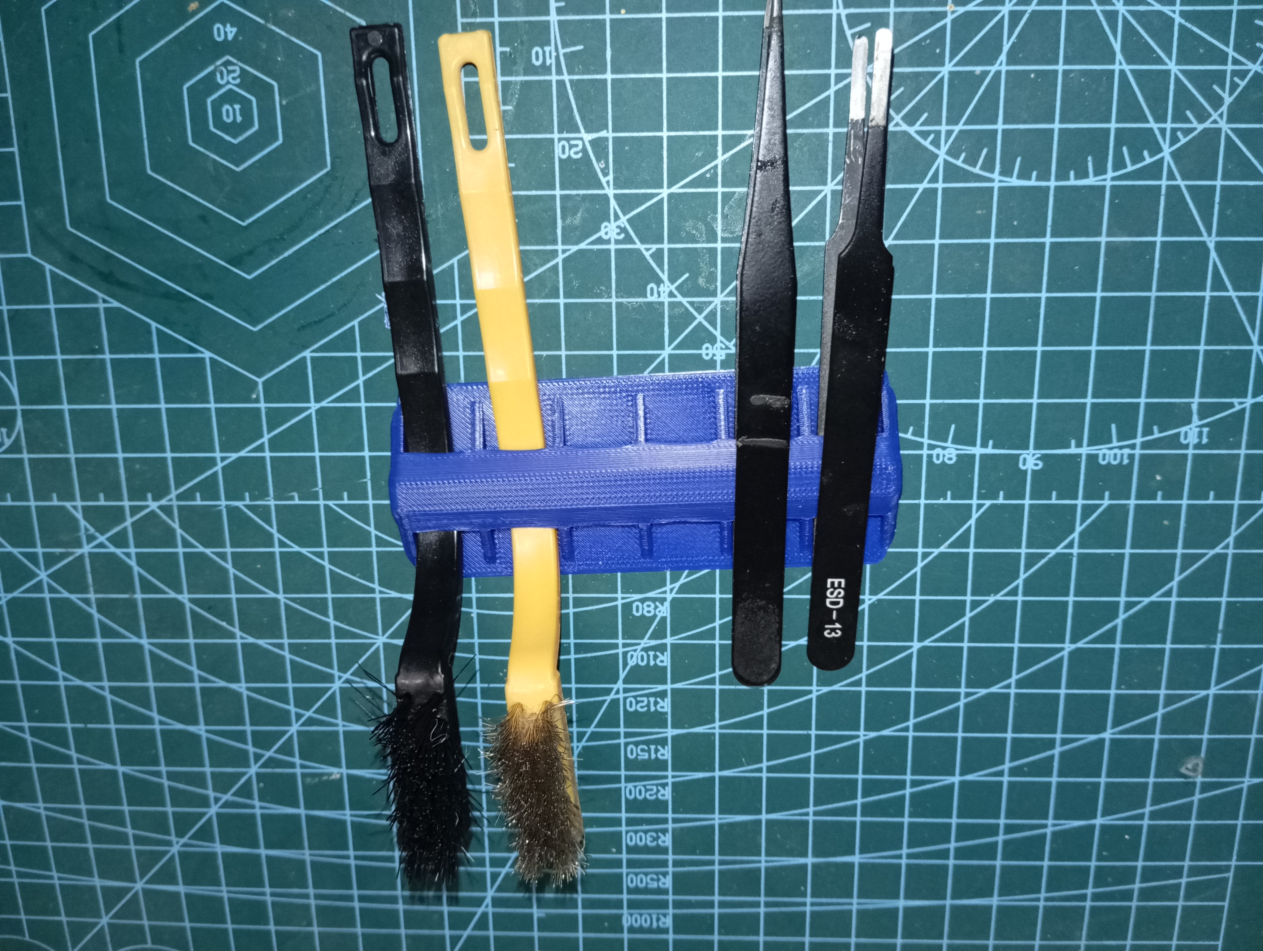 Holder for brass brush and tweezers