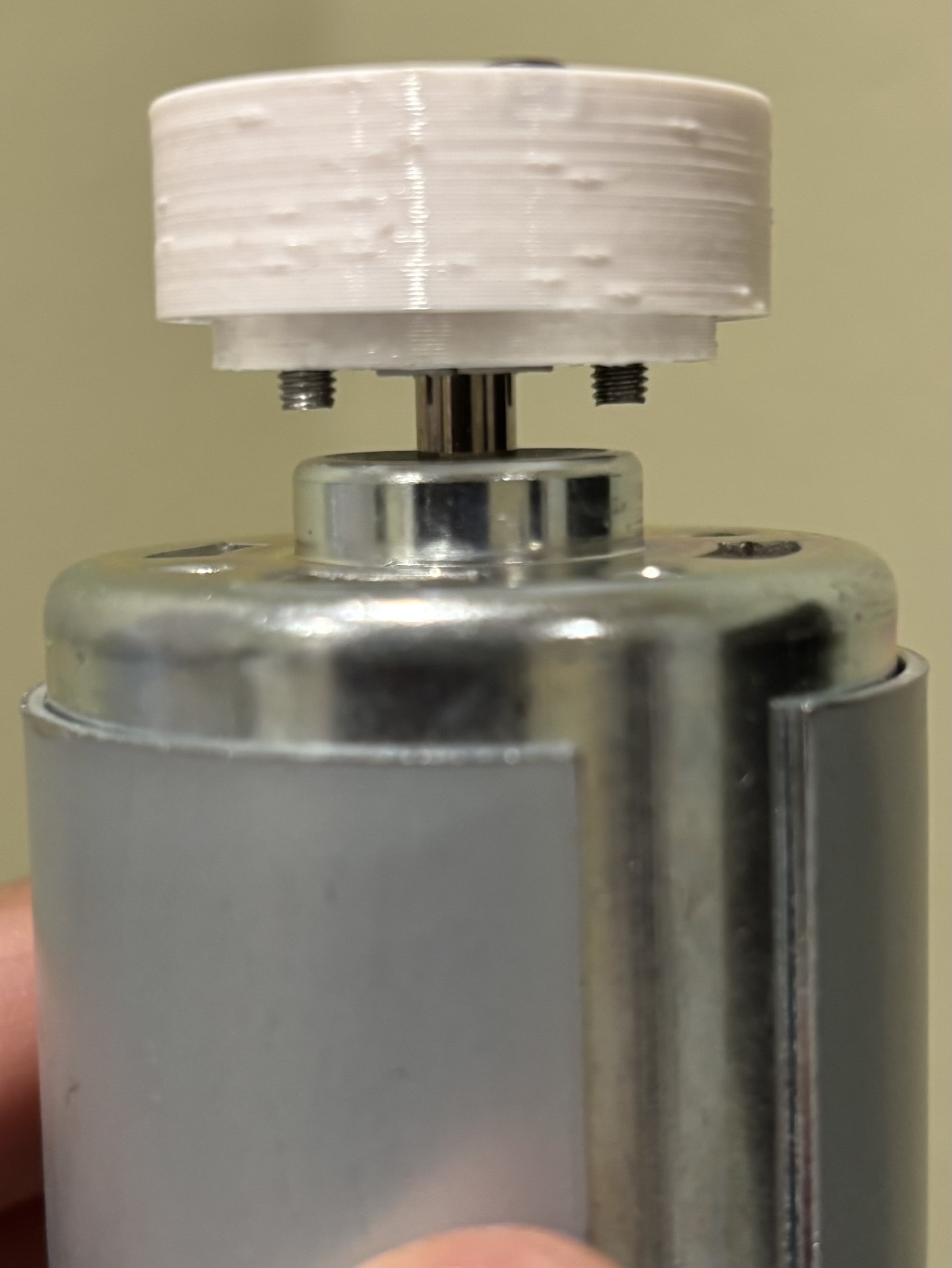 Balanced coupler for smooth motor shaft
