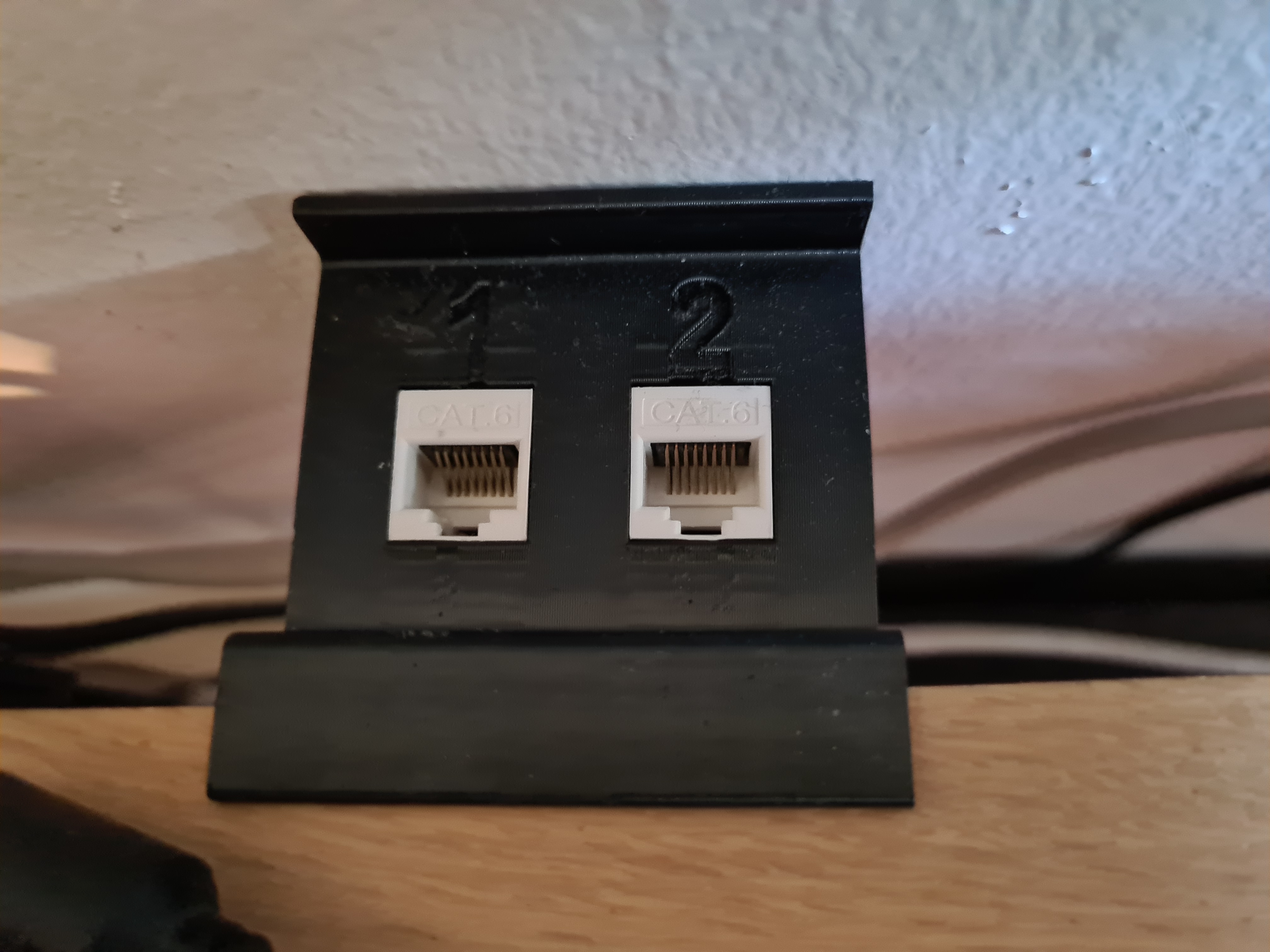 Table spacer with Ethernet Keystone