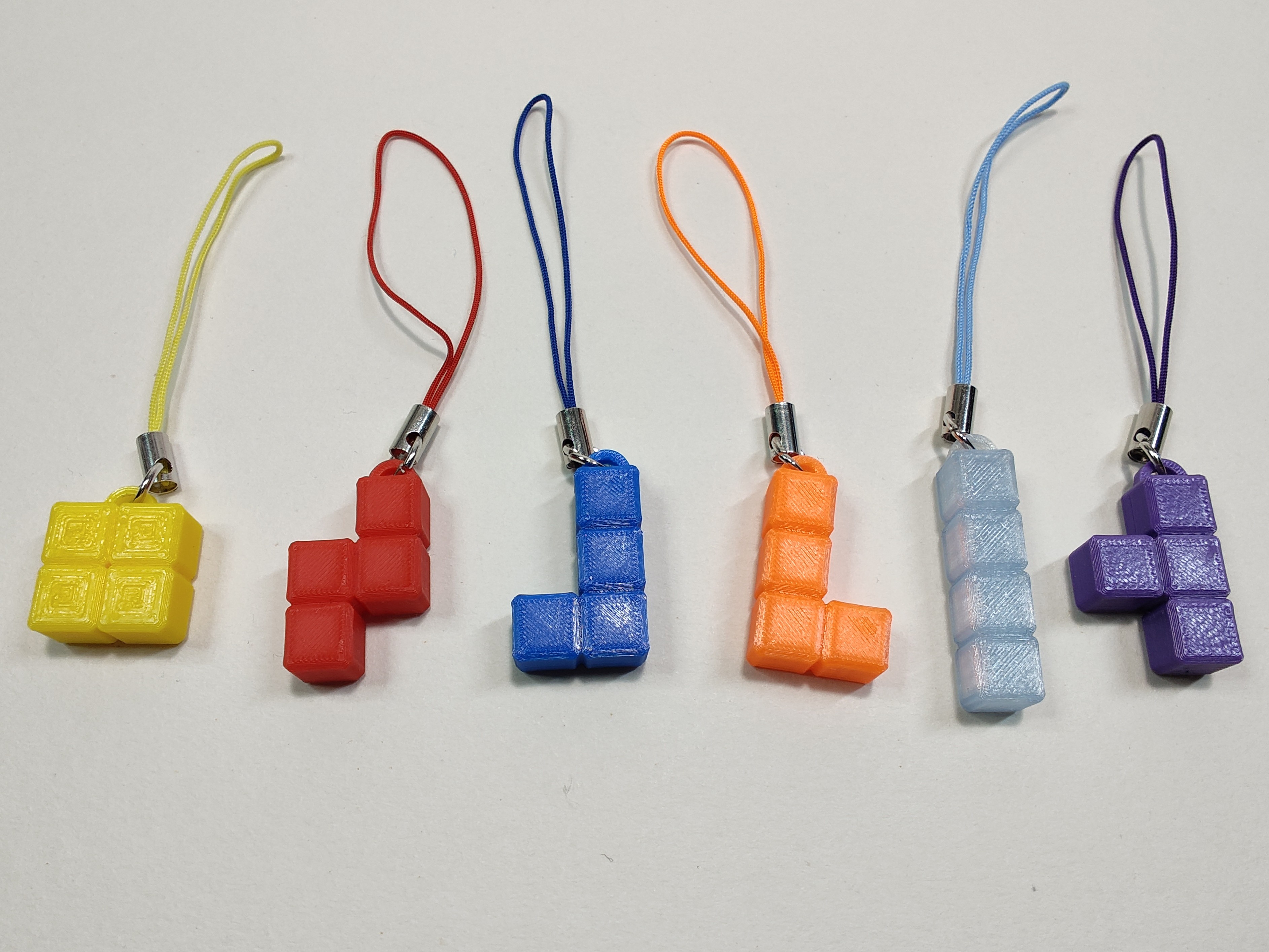 Tetromino charms
