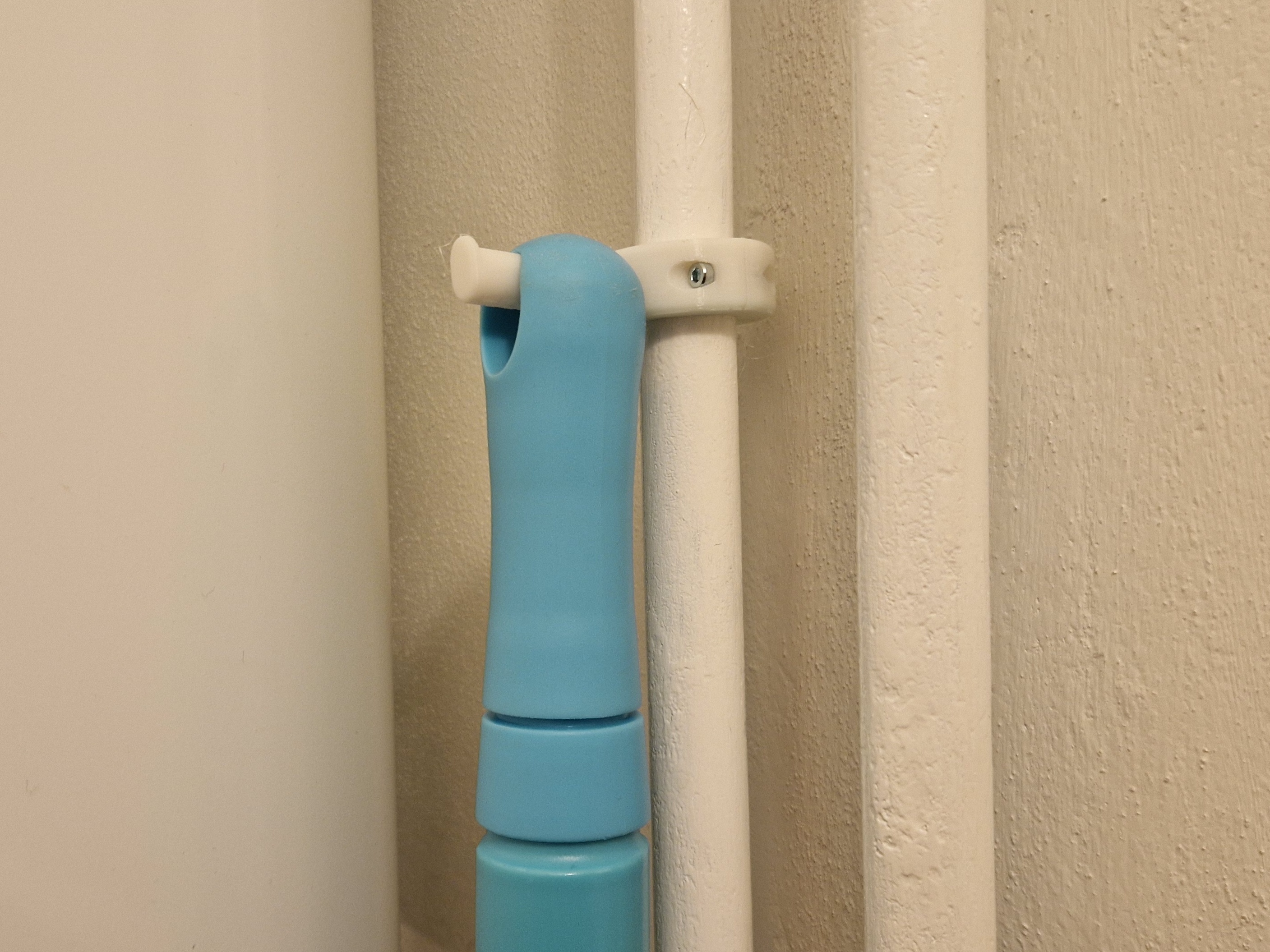 broom holder for pipe