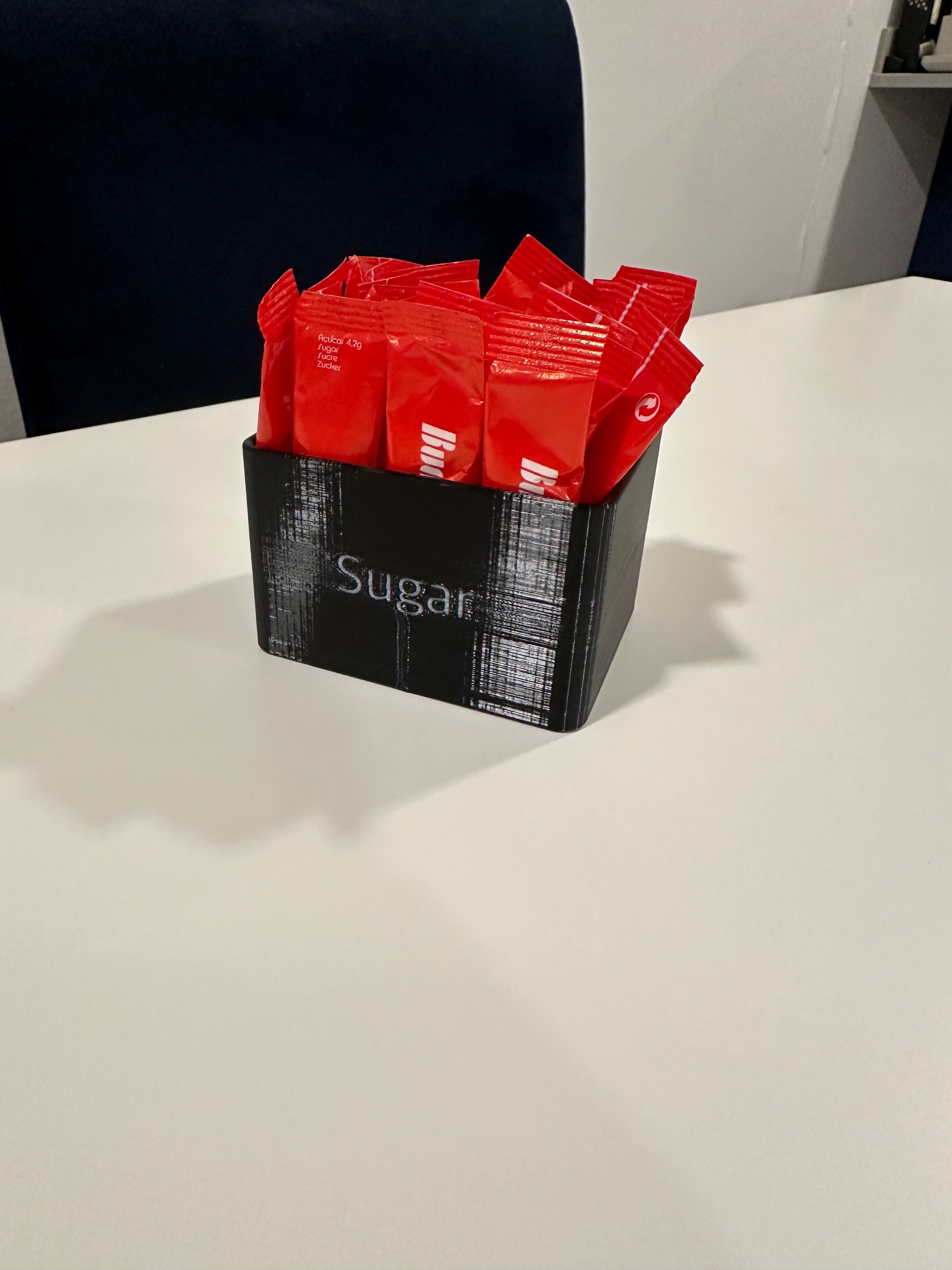 Sugar packet holder