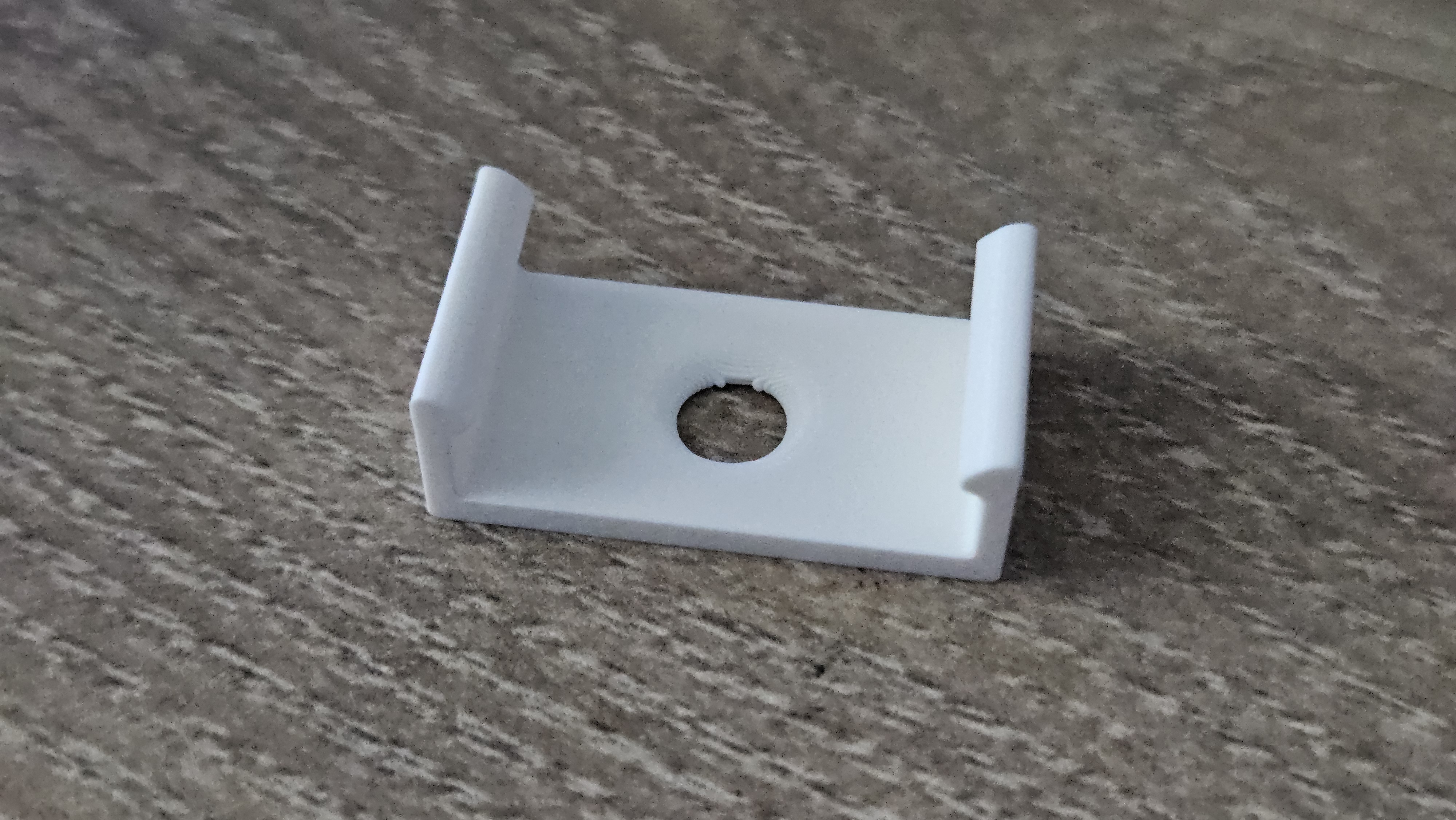Mounting clip for under-cupboard EMOS light