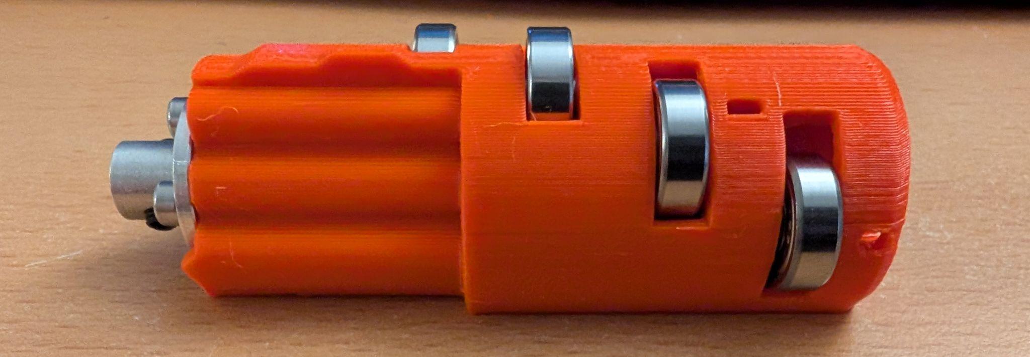 Remixed MMU3 idler body - secure metal pin from falling out