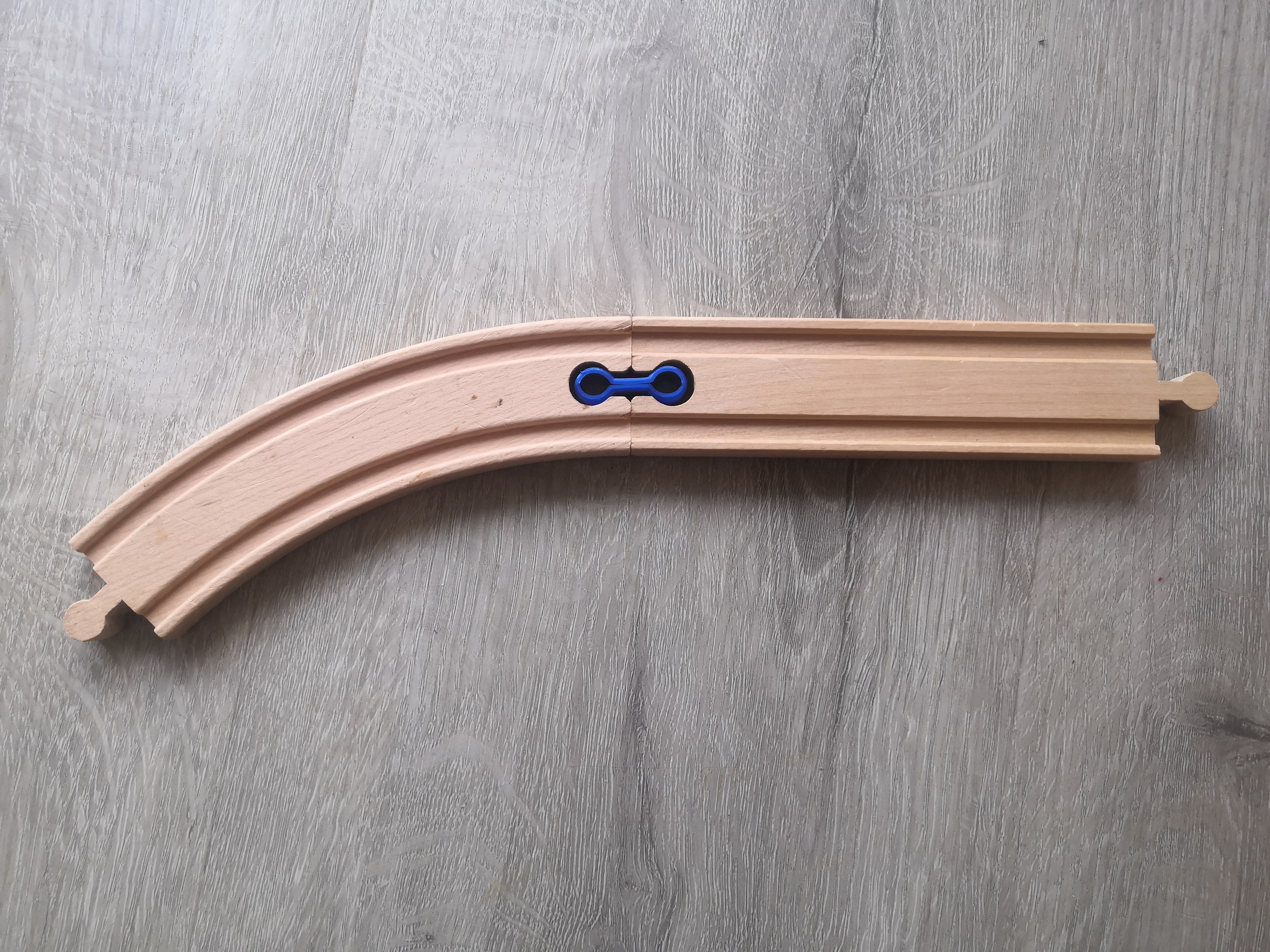 Flexible connector for wood train track