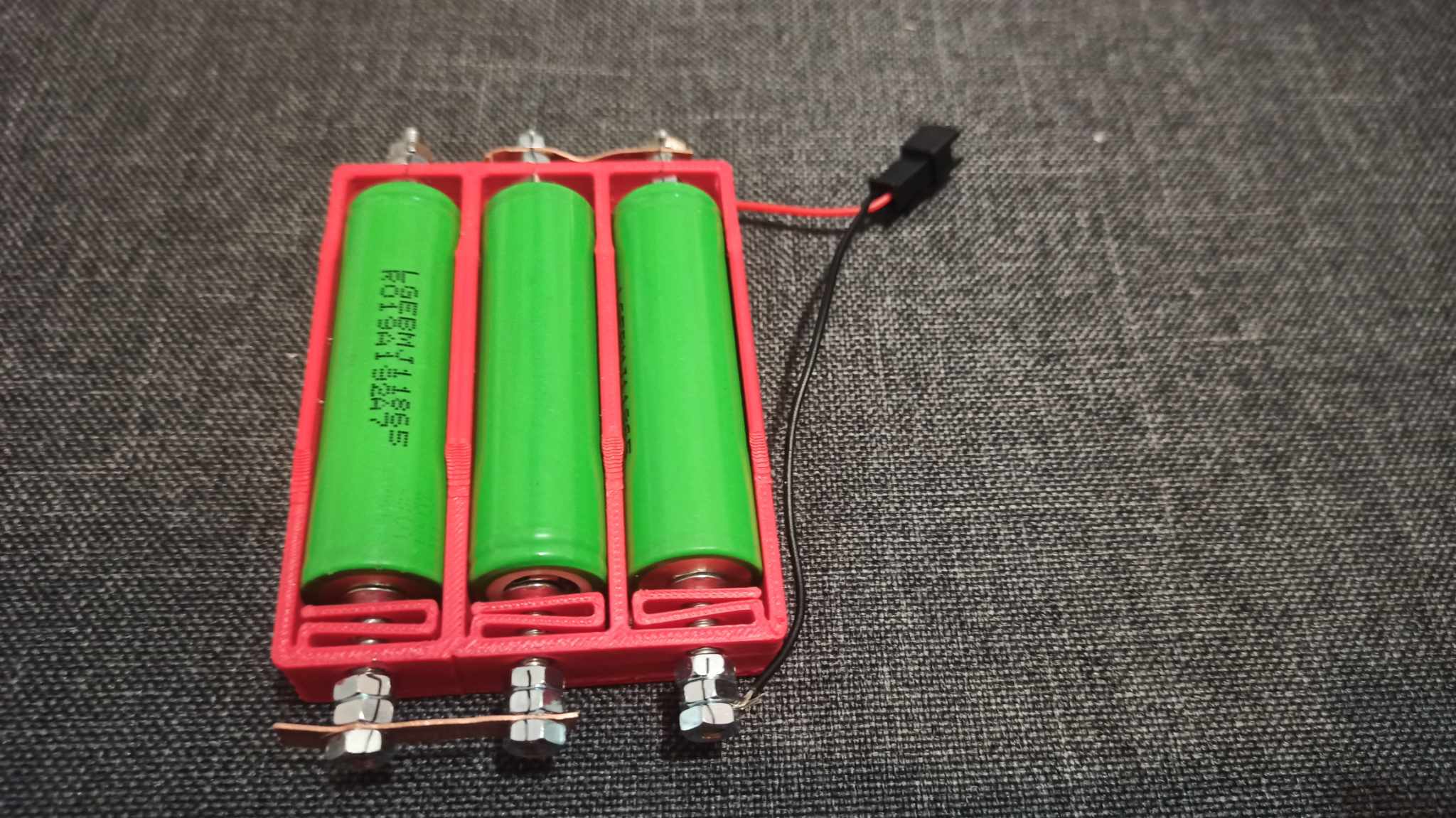 Flexing Battery Holders with Integrated Spring for high current using M4 nuts, bolt and copper sheet